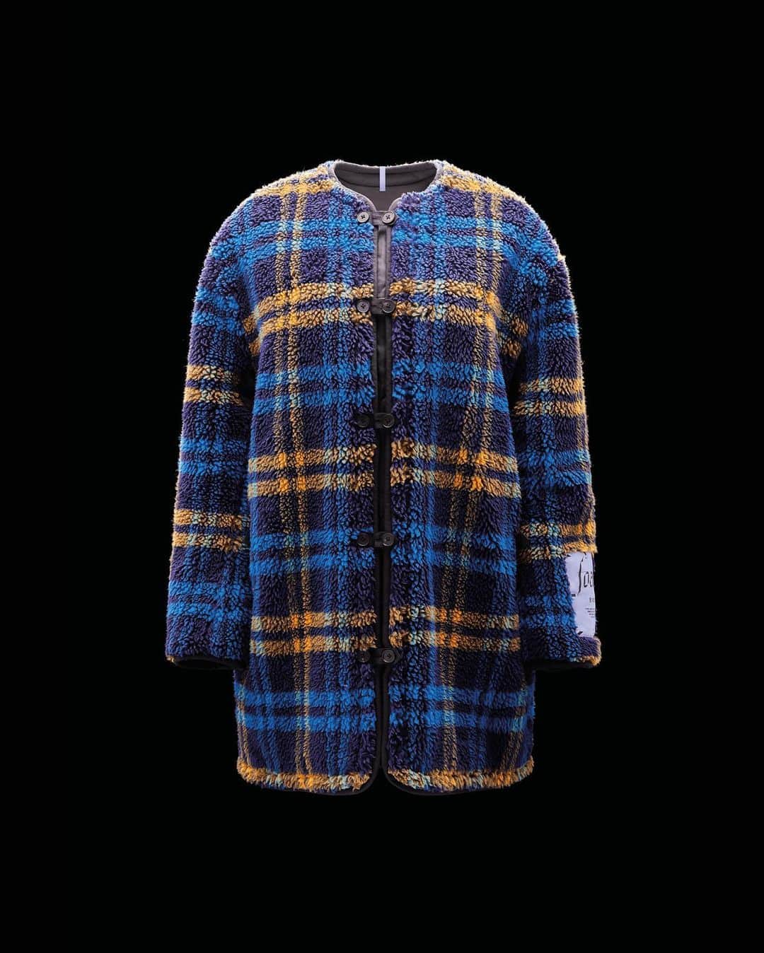 マックキュー アレキサンダー・マックイーンのインスタグラム：「The Reversible Coat from FOAM is crafted from plush recycled fleece. The reverse of the striking blue and yellow check is understated black quilt to keep in the warmth.  Available now in 100 selected stores worldwide and on GOAT.COM」