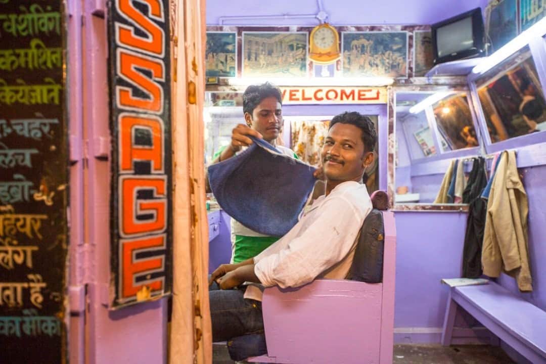 National Geographic Travelさんのインスタグラム写真 - (National Geographic TravelInstagram)「Photo by @emilypolar / Inside the barber shop, a space for relaxing and catching up for those who feel inclined. This shop along one of the many tiny streets in Pushkar always seemed to have someone in the chair doing just that. To see more of the magnificence in the mundane from around the world follow me @emilypolar.」1月29日 12時34分 - natgeotravel