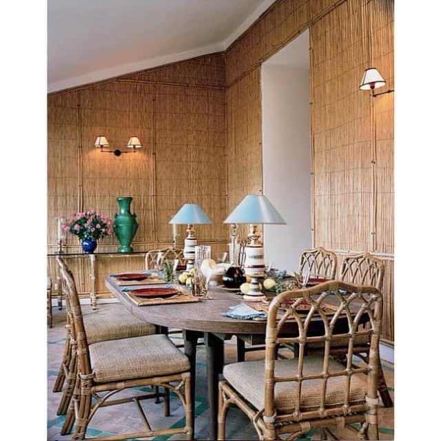 アダムのインスタグラム：「Yves Saint Laurent and Pierre Bergé’s dining room at Villa Mabrouka in Tangier. Built in the 1960s, the dining room features walls covered in bamboo matting, late-19th-century lamps from Madeleine Castaing’s Paris shop and dining chairs by McGuire. Photography by Francois Halard for T Magazine, 2014.」