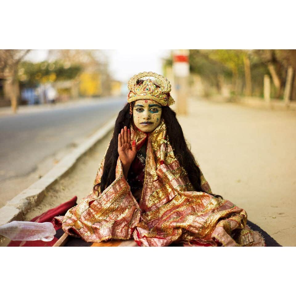 thephotosocietyさんのインスタグラム写真 - (thephotosocietyInstagram)「Photo by @andyrichterphoto / A young devotee blesses pilgrims along the Govardhan parikrama, where Krishna is believed to have spent much of his youth. According to the 10th Canto of Shrimad Bhagavatam, after Krishna protected the inhabitants of Vraj (Vrindavan) from the wrath of Indra, he counseled them to worship the holy hill through puja and parikrama. . From the series and monograph Serpent in the Wilderness. Follow me @andyrichterphoto for more photographs and stories on yoga and beyond. The feature “Finding Calm”, written by Fran Smith, was published in the January 2020 issue of the magazine and explores the myriad benefits of yoga. @thephotosociety @natgeo #yoga #asana #meditation #serpentinthewilderness #kehrerverlag #andyrichter #andyrichterphoto #harekrishna #govardhan #india #parakrama #bhaktiyoga」1月30日 5時12分 - thephotosociety