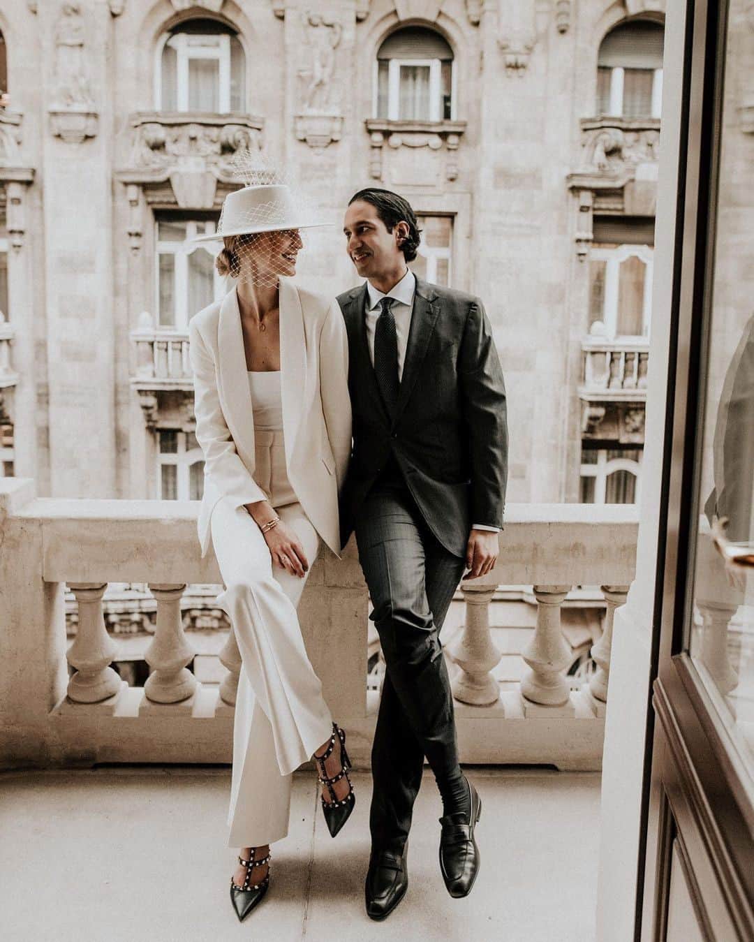 British Vogueさんのインスタグラム写真 - (British VogueInstagram)「Model @VanessaAxente was all set to get married in a beautiful historic building in her native Hungary, wearing a Daalarna Couture gown and watched by 250 guests, until, in a tale that will be all too familiar to couples around the world, Covid put paid to those plans. Instead, the bride and her husband defied the odds to stage a chic micro wedding in a Budapest registry office. Click the link in bio for all the details, and why she spontaneously swapped her dream dress for a #BiancaJagger style bridal suit.   #VanessaAxente and Rahil Gupta photographed by @JardinDelAylaan.」1月31日 0時00分 - britishvogue