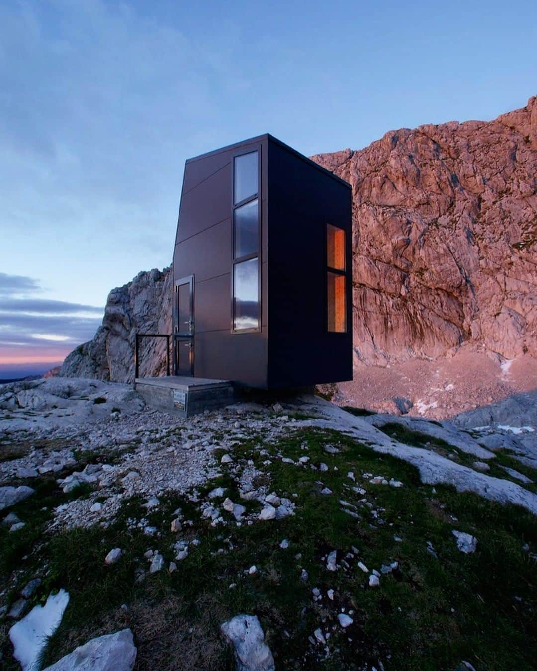 Architecture - Housesのインスタグラム：「⁣ A shelter for mountaineers 🏔️⁣ Bivouac is located in the Kamnik Alps and is open all the time for all visitors 🙌. Its design, the vertical windows are placed beside the corner and enable best view of the mountains that dominates the scenery. Would you dare to go up there? Leave your comments! ⁣ _____⁣⁣⁣⁣⁣⁣⁣⁣⁣ 📐 Miha Kajzelj⁣ 📸 Trimo⁣ 📍Kranj, Slovenia⁣ #archidesignhome⁣⁣⁣⁣⁣ _____⁣⁣⁣⁣⁣⁣⁣⁣⁣ #design #architecture #architect #arquitectura #luxury #architettura #archilovers #cabinlovers #hotels ‎#amazing #architecturephotography #amazingarchitecture⁣ #construction #archilovers ‎#amazing #picoftheday #archigram #nature」