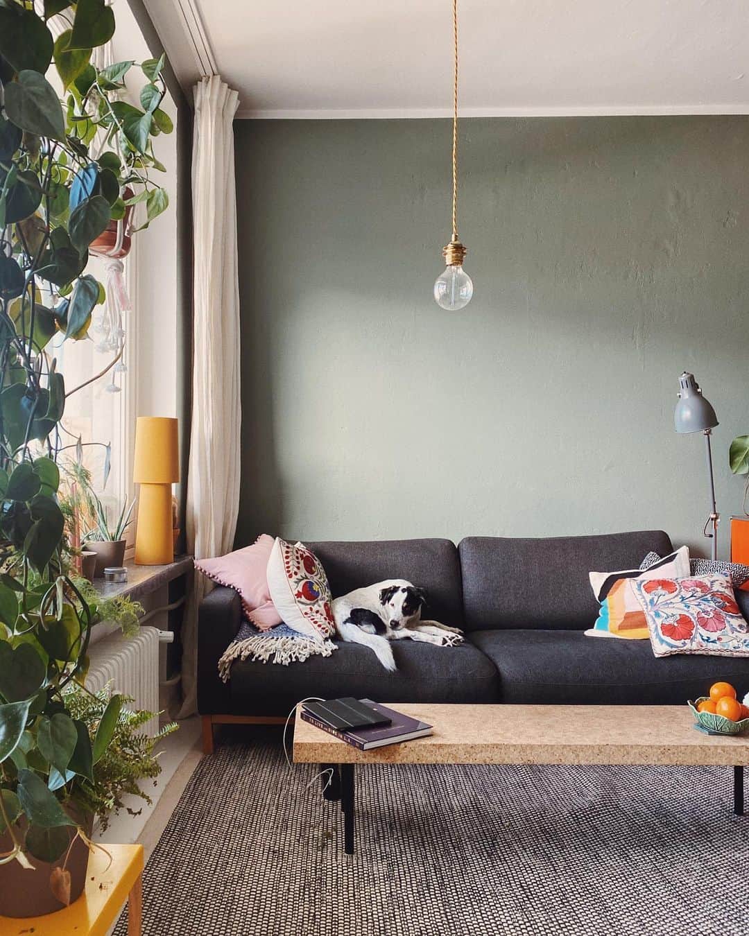 STIL IN BERLINのインスタグラム：「Last week, I rearranged my entire living room, because what else is there to do? In the process, I broke the glass lampshade, two minutes before going into a zoom class I was hosting, hence the bare bulb. I took this photo on Saturday, when the snow was bringing in all that light. How are you passing the time? #nicothemutt」