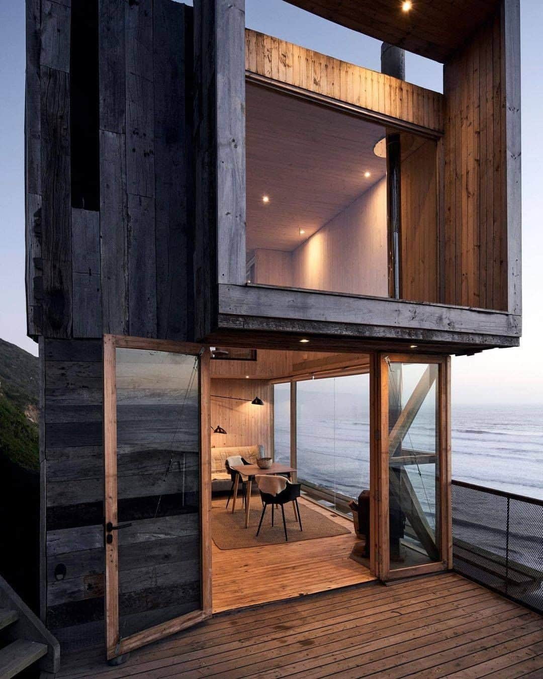 Discover Earthさんのインスタグラム写真 - (Discover EarthInstagram)「Would you like to spend the night there ?  This newly opened cottage is located in the Lagunillas area, and has an unbeatable view. Built on stilts, its large windows create the illusion of floating on the sea.  #discoverchile🇨🇱 with @estudiopalma  . . . . .  #chile  #santiago  #instachile  #chilegram ​#instasantiag ​#temuc ​#viñadelma  #iquique  #arica ​#antofagast ​#laseren  #valdivia  #rancagua  #siguemeytesigo  #talca  #puertomontt  #archilovers  #architecturelovers  #building  #architectureporn  #architecturephotography  #buildings  #archidaily  #arquitectura  #architect  #architexture  #arquitetura  #interior  #minimal」2月2日 1時00分 - discoverearth