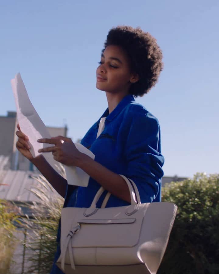 Longchampのインスタグラム：「A letter from her ex... Will she toss it off the building or keep it forever? Featuring our #LongchampMailbox bag and fashions from the SS21 collection.   #LongchampTresParis #LongchampSS21 #Longchamp」