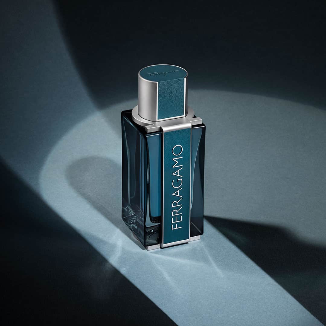 サルヴァトーレ・フェラガモのインスタグラム：「Intense and refined, this captivating fragrance plays subtly with contrasting notes of radiance and seduction. Discover FERRAGAMO Intense Leather, now drenched in a penetrating blue-green teal lacquer, its slender shape recalls the urban landscape where the Ferragamo man lives: like a skyscraper, the flacon invites discovering its details from different perspectives. #FerragamoParfums」