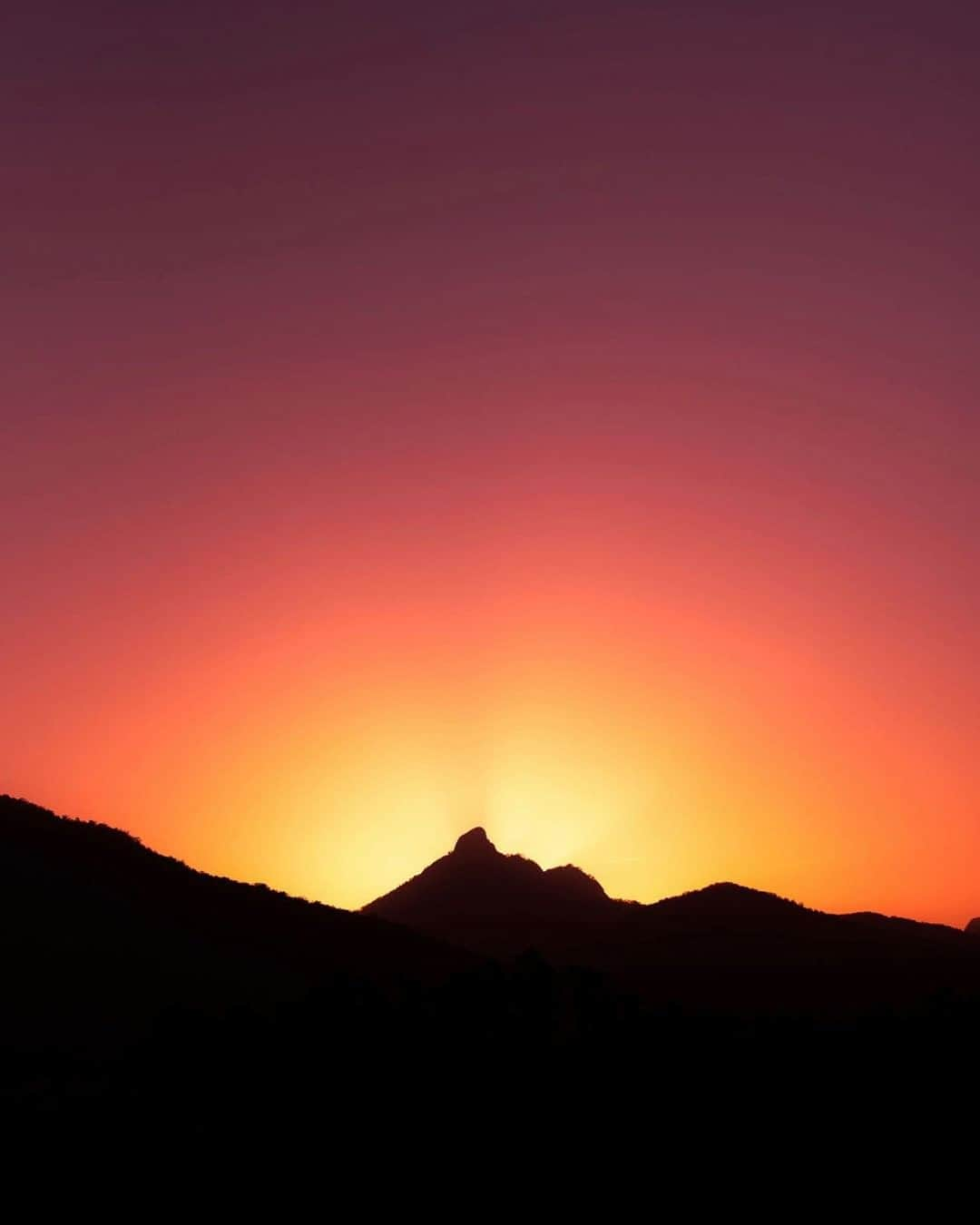 Nikon Australiaさんのインスタグラム写真 - (Nikon AustraliaInstagram)「"I was out and about in my local area taking the final shots for my calendars. I had taken countless photographs of Mt. Wollumbin in the past, but the light this afternoon seemed to be extraordinary. I didn't plan for this shot and was about to head home when the last sun ray had caught the corner of my eye. I quickly turned around and ran back uphill.   Right in front of me, everything unraveled. I was spontaneously struck with this invigorating excitement as this breath-taking view revealed itself to me. There is something very special about landscape photography." - @kononiukjacob  Camera: Nikon D750 Lens: AF-S NIKKOR 70-200mm f/2.8 FL Settings: f/7.1  1/1600s  ISO 100  #Nikon #MyNikonLife #NikonAustralia #NikonD750 #SunsetPhotography #Sunset #LandscapePhotography #Mountains #SunsetLover #Silhouette」2月3日 9時00分 - nikonaustralia