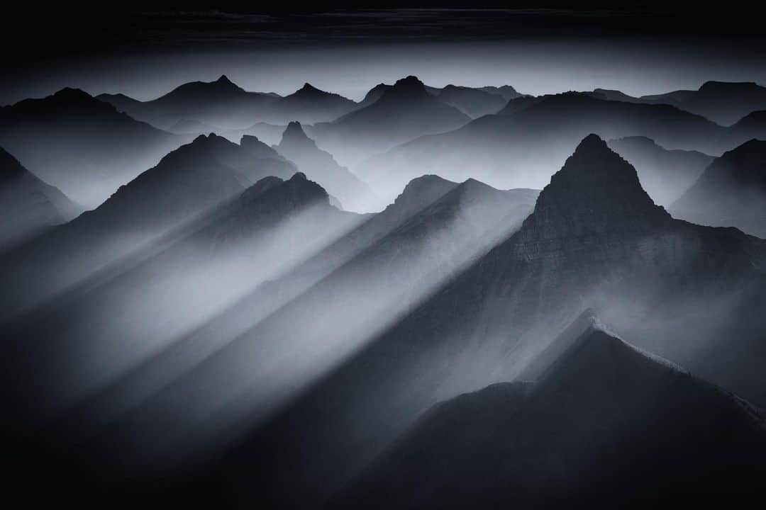 Keith Ladzinskiのインスタグラム：「Smoke, light and shadows pouring down over the layered valleys of @glaciernps / for @natgeo」