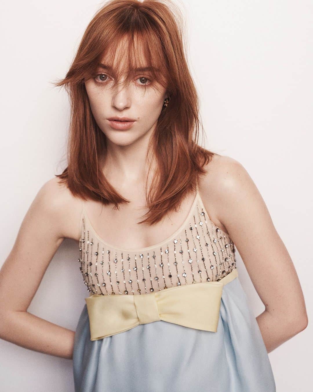 のインスタグラム：「A baby-doll mood. @PhoebeDynevor wearing #MiuMiuSS21 collection on the pages of @LOfficielUSA  Photography by #TomSchirmacher Styling by #LauraFerrara  #MiuMiuEditorials #MiuMiuGirls」