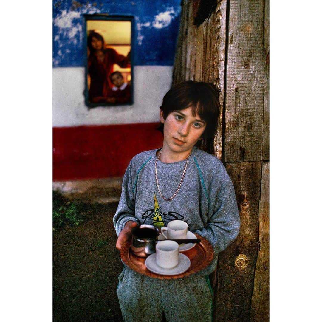スティーブ・マカリーのインスタグラム：「I stopped in this village to photograph the Yugoslavian flag painted on the side of a house. This family offered me a cup of coffee; I was touched by their hospitality. #Montenegro, 1989.  #SteveMcCurry」