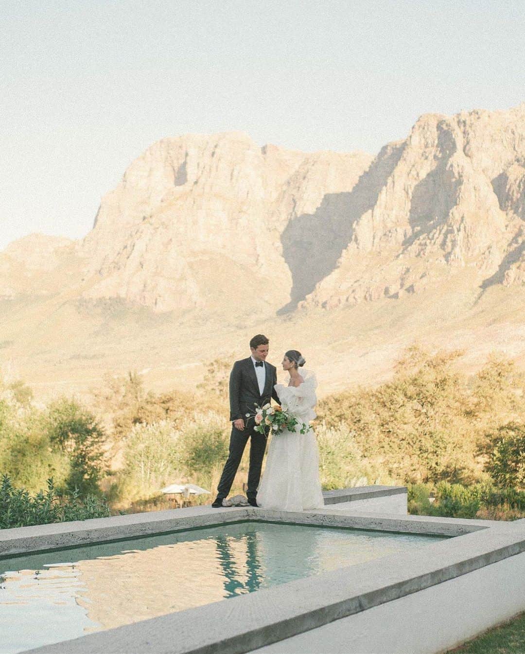 Harper's BAZAARさんのインスタグラム写真 - (Harper's BAZAARInstagram)「This was a love story we have been waiting to tell for a year. @BettinaLooney, personal stylist and tastemaker, wed @Carlos.Sego in South Africa in February 2020, right before the pandemic and its subsequent lockdowns put the world on pause. Per Bettina’s personal style, the Segovias’ wedding became an Instagram source of inspiration to brides worldwide who spent the year planning, postponing, and replanning their weddings locally and abroad. In honor of the couple’s one-year anniversary, Bettina shared their story—and all the decor, details, fashion moments, and photos of their four-day affair—exclusively with BAZAAR Bride. Link in bio.   Photographer: @ladichosa  Planner: @annemanncelebrates  Stylist: @iamdanielobasi  Makeup: @rachelsingerclark」3月1日 3時45分 - harpersbazaarus