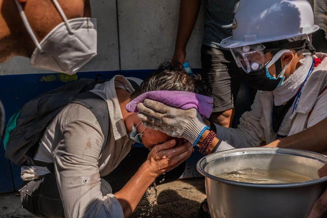 TIME Magazineさんのインスタグラム写真 - (TIME MagazineInstagram)「At least 18 people were killed in Myanmar on Feb. 28 after security forces opened fire on crowds peacefully demonstrating against the military takeover, @apnews reports, citing the @unitednations. Deaths were reported in Yangon, the country's largest city, as well as Dawei, Mandalay, Myeik, Bago and Pokokku. U.N. Secretary-General António Guterres "strongly" condemned the crackdown in a statement, calling the use of lethal force against peaceful protesters "unacceptable" and urging the international community to "come together and send a clear signal to the military that it must respect the will of the people of Myanmar as expressed through the election and stop the repression." In these photographs: protesters defend themselves in Yangon; a protester washes his face after riot police fired tear gas; a protester uses a makeshift shield as people watch from a nearby building; and a protester who was injured after being shot at with live rounds is transported to a makeshift medical center in Mandalay. Photographs by @hkun_lat—@gettyimages and Stringer—@afpphoto/@gettyimages」3月1日 11時49分 - time