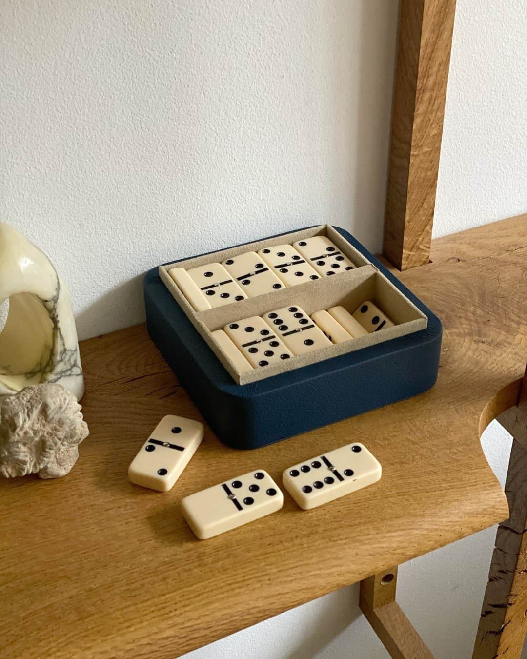 MR PORTERのインスタグラム：「Ideal for evenings at home or to display on a shelf or coffee table, this sleek William & Son dominoes set is housed in a beautiful blue case made from durable Grampian leather and lined with soft Alcantara. Anyone for a game? #MRPORTERathome  📸 @odellsstudios」