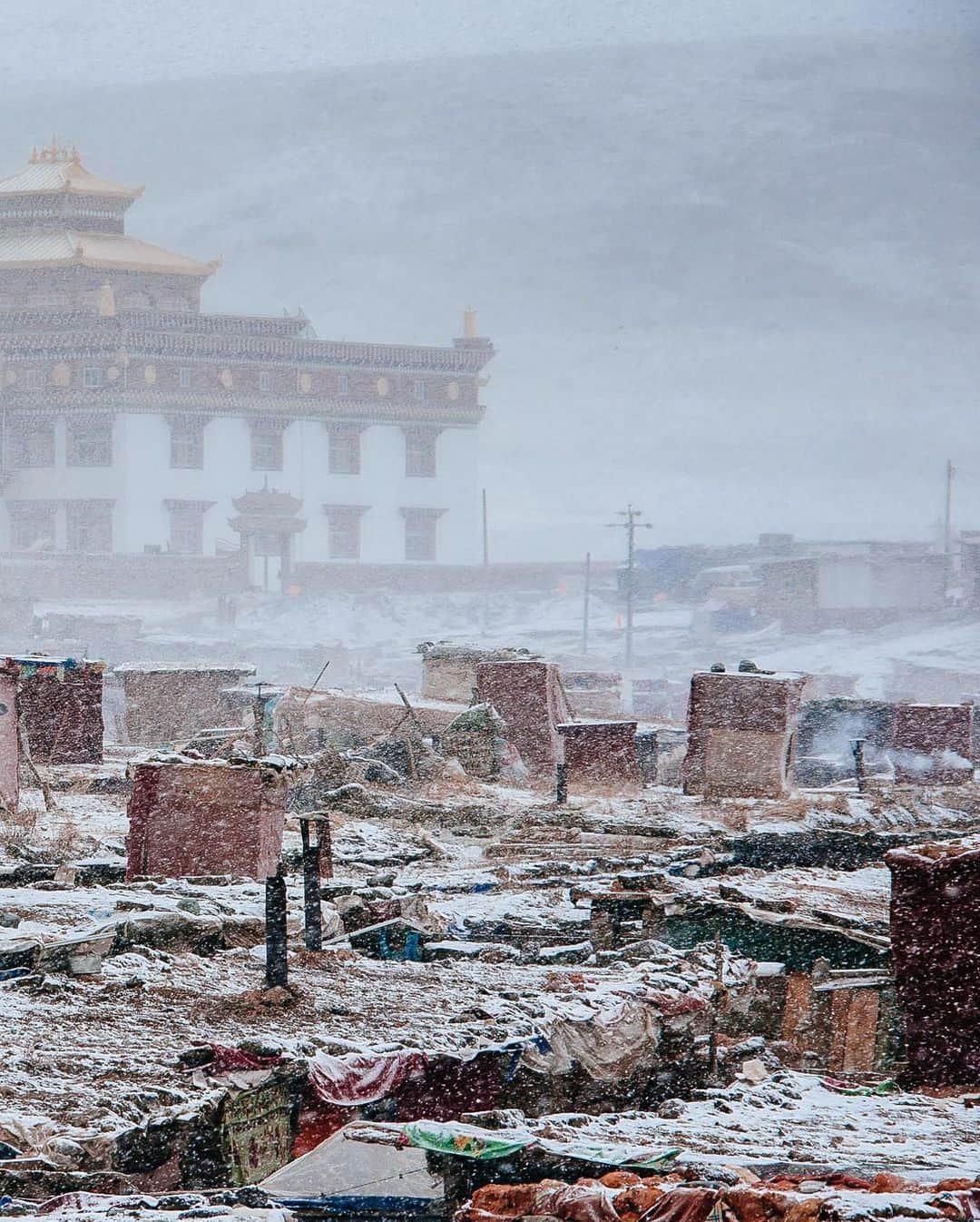 National Geographic Travelさんのインスタグラム写真 - (National Geographic TravelInstagram)「Photo by @junmichaelpark / A blizzard sweeps through the main monastery and the nuns' quarters of Yarchen Gar. Located in Garze Tibetan Autonomous Prefecture, Sichuan Province, China, Yarchen Gar was once known for its high proportion of Buddhist nuns. At its peak there were more than 10,000 people living and practicing Tibetan Buddhism, and 80 percent of them were women. For more photos and stories, follow @junmichaelpark.」2月9日 0時39分 - natgeotravel