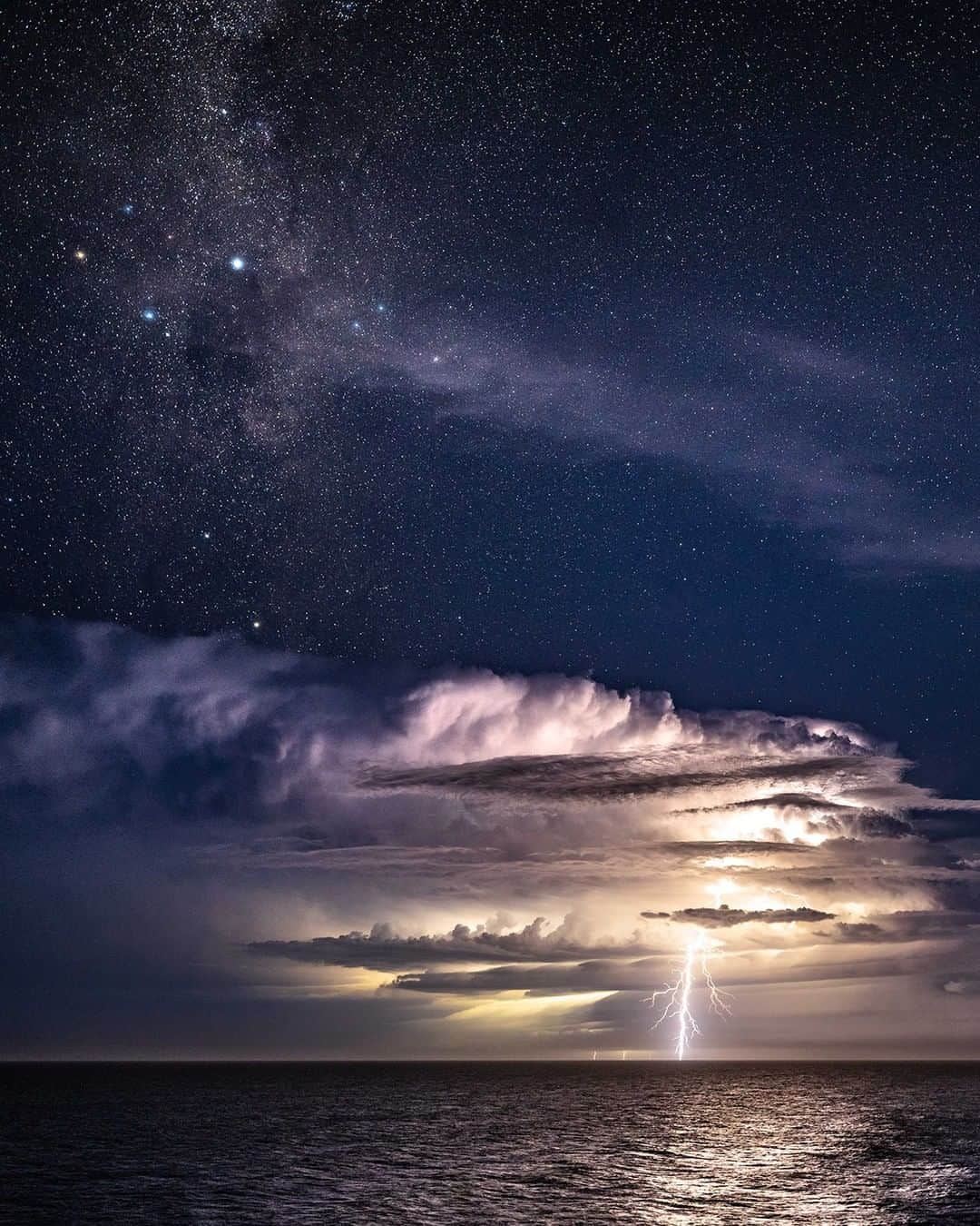 Nikon Australiaのインスタグラム：「"Seeing this ocean storm flashing under the Southern Cross went from awesome to amazing when a huge bolt lit up the night. Unbelievably, a shooting star also shot through the sky at the same time. Nature!" - @willeadesphotography   Camera: Nikon Z 7 Lens: NIKKOR Z 14-24mm f/2.8 S Settings: 24mm  f/2.8  20s  ISO 500  #Nikon #MyNikonLife #NikonAustralia #NikonZ7 #Z7 #ZSeriesAU #StormPhotography #Astrophotography #StormChasers #Nightscapers #Storm」