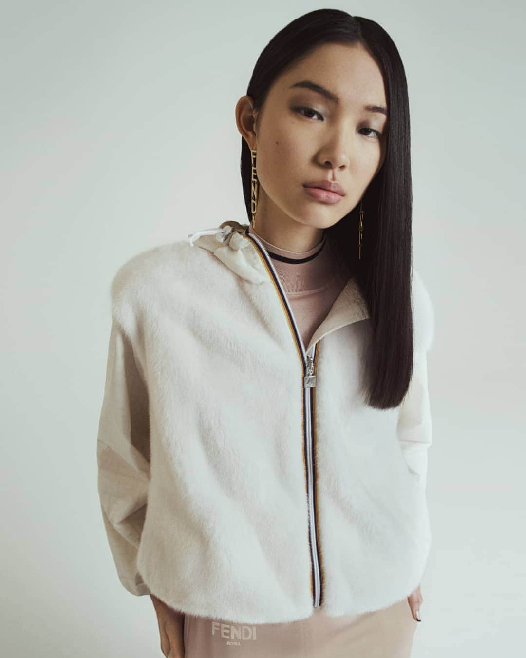 Fendiのインスタグラム：「Equal parts practical and covetable – cozy up in the #FendiXKWAY edit starring plush textures, weatherproof finishes, and @kway_official’s signature stripe trim. Shop the latest looks from the #FendiFW20 capsule collection, while you still can, at the link in bio.  Photographer: @yvanfabing Stylist: @giovannidariolaudicina Models: @bibiabdulkadir, Lisa Lu, @brittvdherik_, @zj_zhengjie, @freekiven」