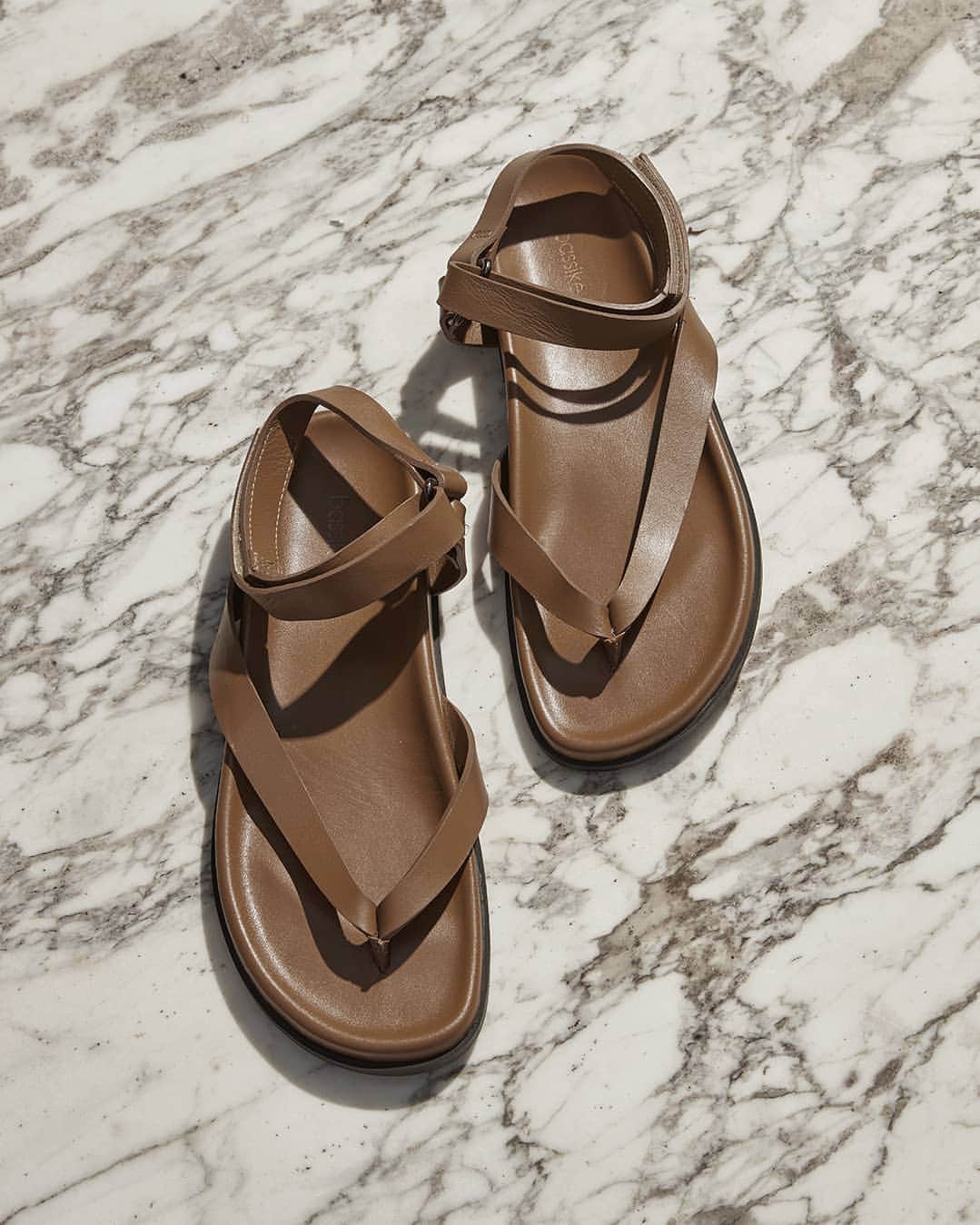 ベイシークのインスタグラム：「accessories focus.  the wrapped leather sandal, updated in new season tan.  ​pre collection 21  now available in-store and online. ​ ​#bassike ​」