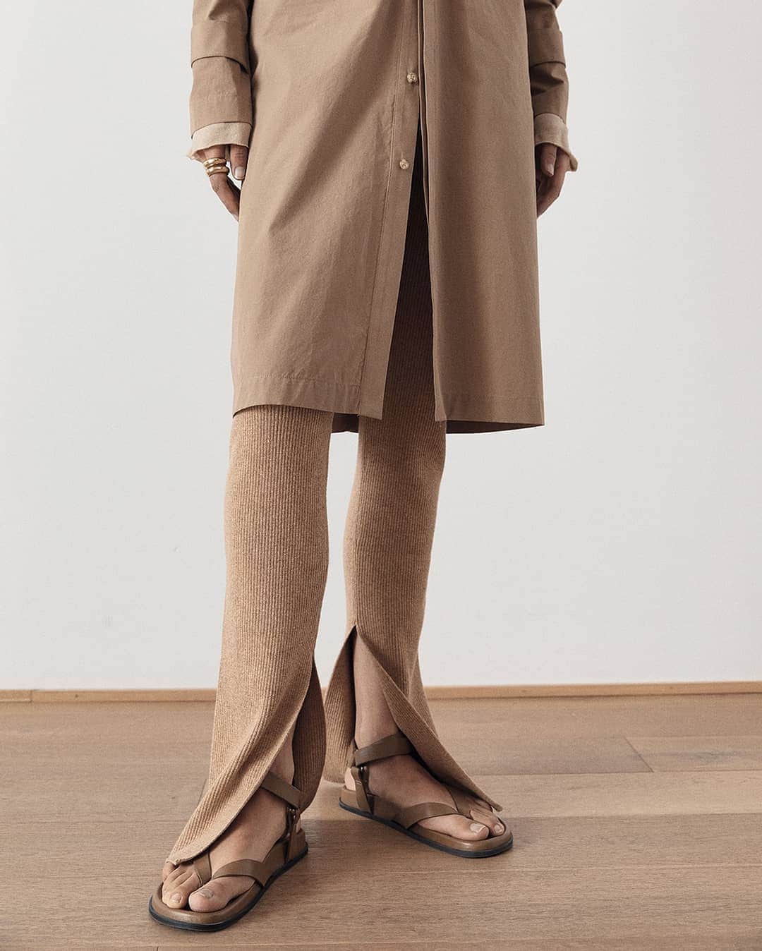 ベイシークのインスタグラム：「tonal layers. ​ ​the cotton cinched long sleeve dress styled with the raised neck slim long sleeve t.shirt and caramel knitted flared tights. tap to shop. ​ ​#bassike」