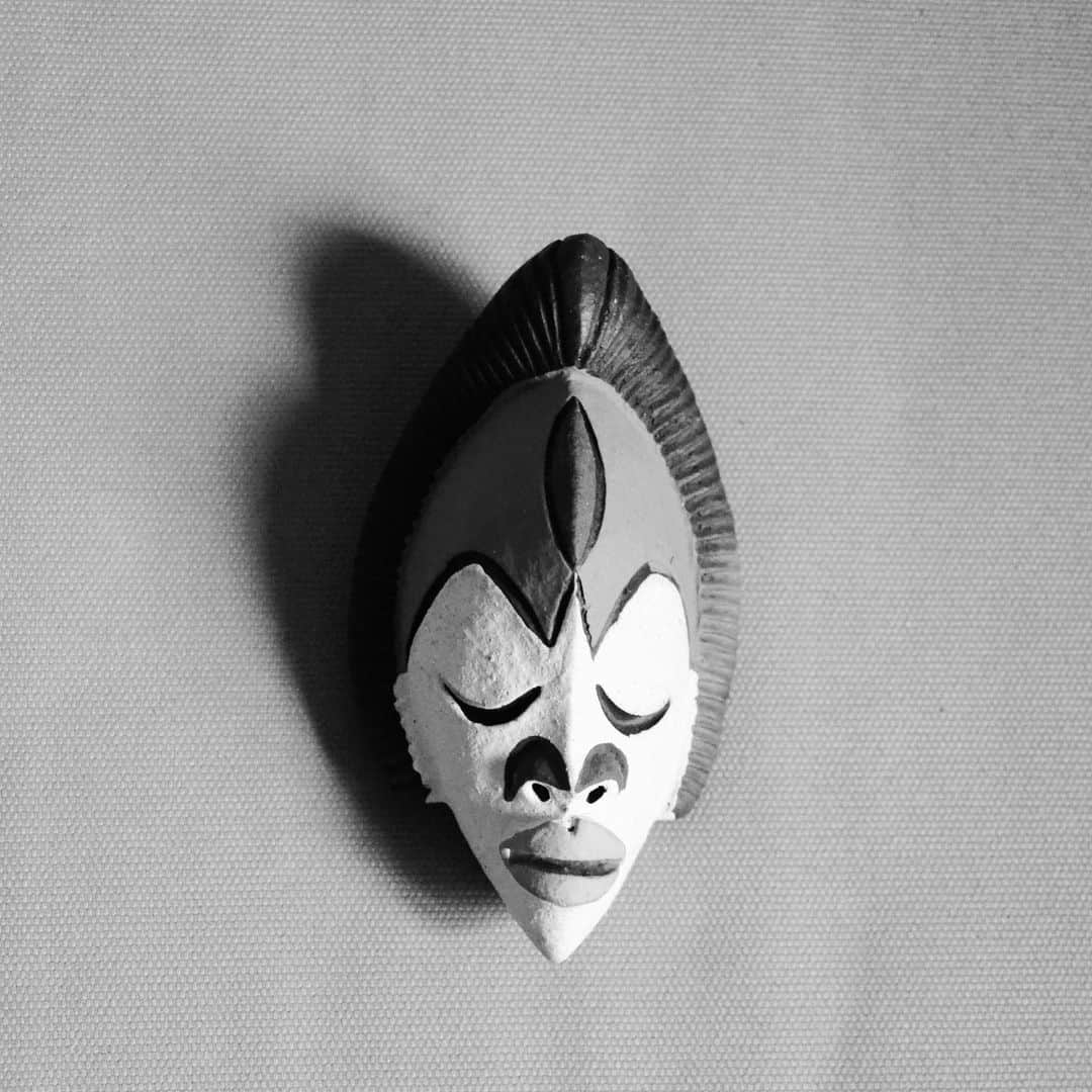 Grace Bonneyのインスタグラム：「Day 2 - 🖊 : @yaquimpii take over - Design, design...  When being asked, what is your creative process? Well, I don’t design things but I give them the spirit they need to become alive. That’s all the point about African masks where I take inspiration. Because they were made to serve a purpose and not just to be objects of decoration or museum objects, everything I do follow the same process. Everything started with this tiny mask of #Punu tribe inspiration from #Gabon. I bought it once back in #Cameroon 🇨🇲 in 2010. It has remained in a box until 2014 when I started walking around the 6th arrondissement of Paris to find out plenty of others masks were stocked there and no one knew about it (I then launched a walking tour to show and explain African mask history - post 4). Launching my company @littleafricaparis, at some point (short story), this mask appears to me as the one to carry our values ​​but also our missions. I took it to my graphic designer and after a few back and forth we ended up with this. As said, I don’t design but (I do draw 😉) I also know I need to feed designers I am working with to arrive to the point you can feel the power and the values we want to share.  On the next post, I am gonna show how from this experience with masks, I got inspired to create a line of products, for interior design, museums/bookstores shops, and more...」