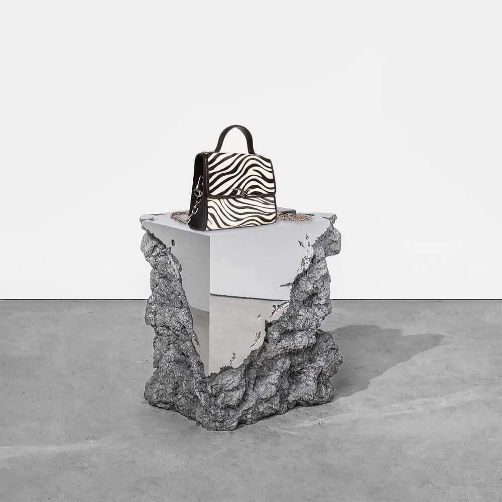 イーチ x アザーのインスタグラム：「SCULPTED ZEBRA CALF HAIR AND LEATHER TOP HANDLE BAG.」