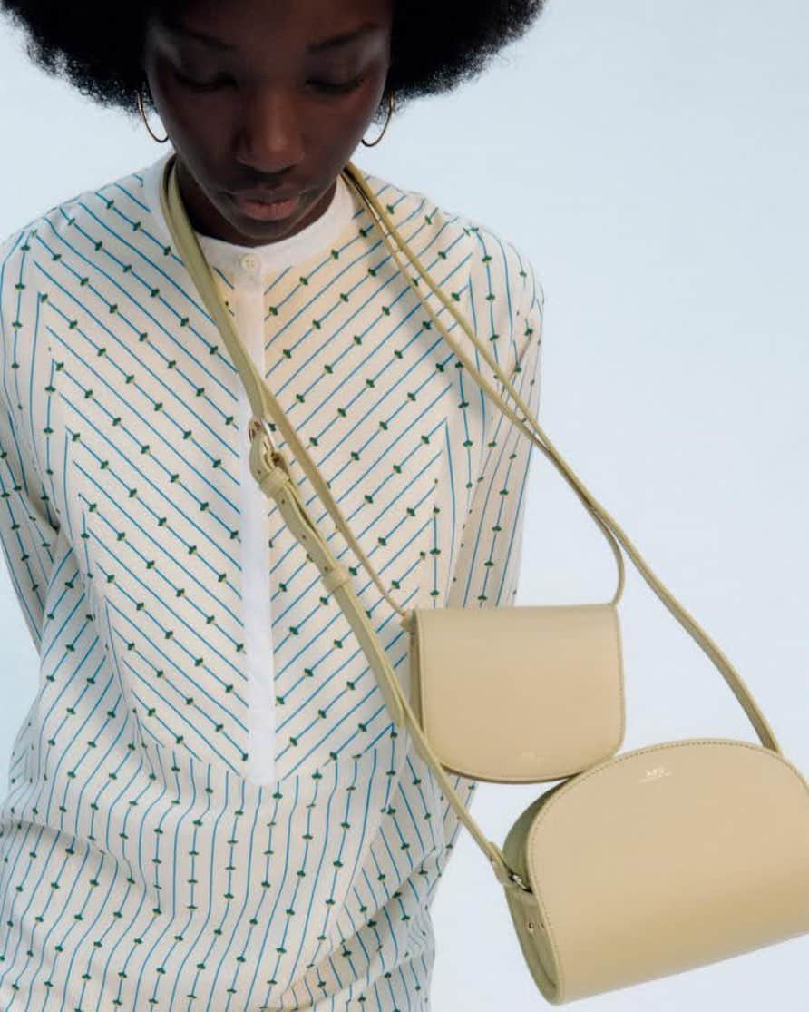 アーペーセーのインスタグラム：「A.P.C. Spring/Summer 2021 collection.  @assabaradjii is wearing the Demi-Lune mini bag and the Mini Dina bag. ⠀ Photography : @timelkaim  Creative direction: @suzannekoller ⠀ ⠀ Available in stores and at apc.fr⠀ ⠀ #APC #APCcollection #APCSS21 #APCaccessories #APCbag」
