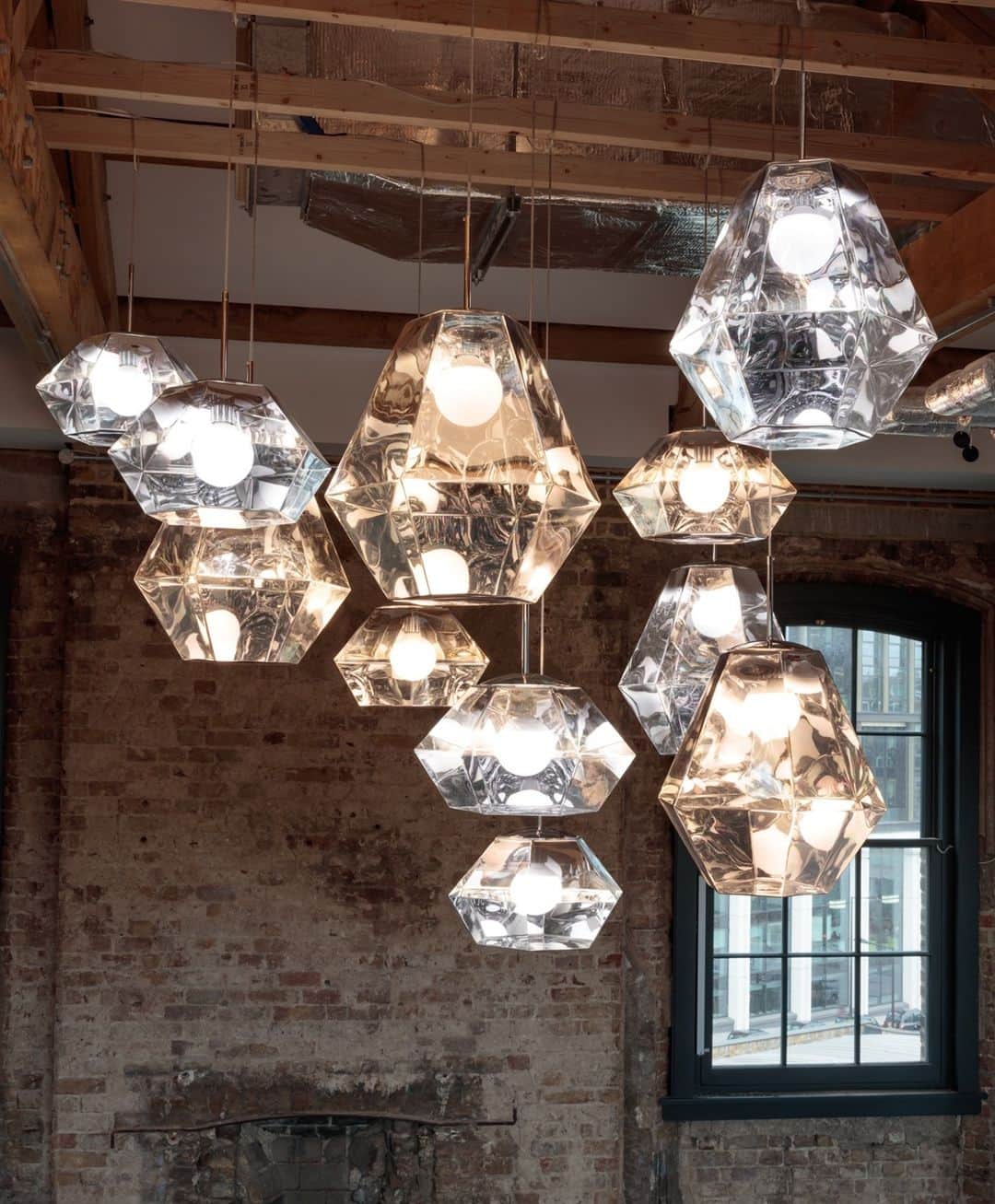 トム ディクソンのインスタグラム：「A space-age mirror finish when off, a translucent kaleidoscopic gem when switched on... An extraordinary cluster of CUT pendants, cut like a diamond for increased luminosity.⁠」