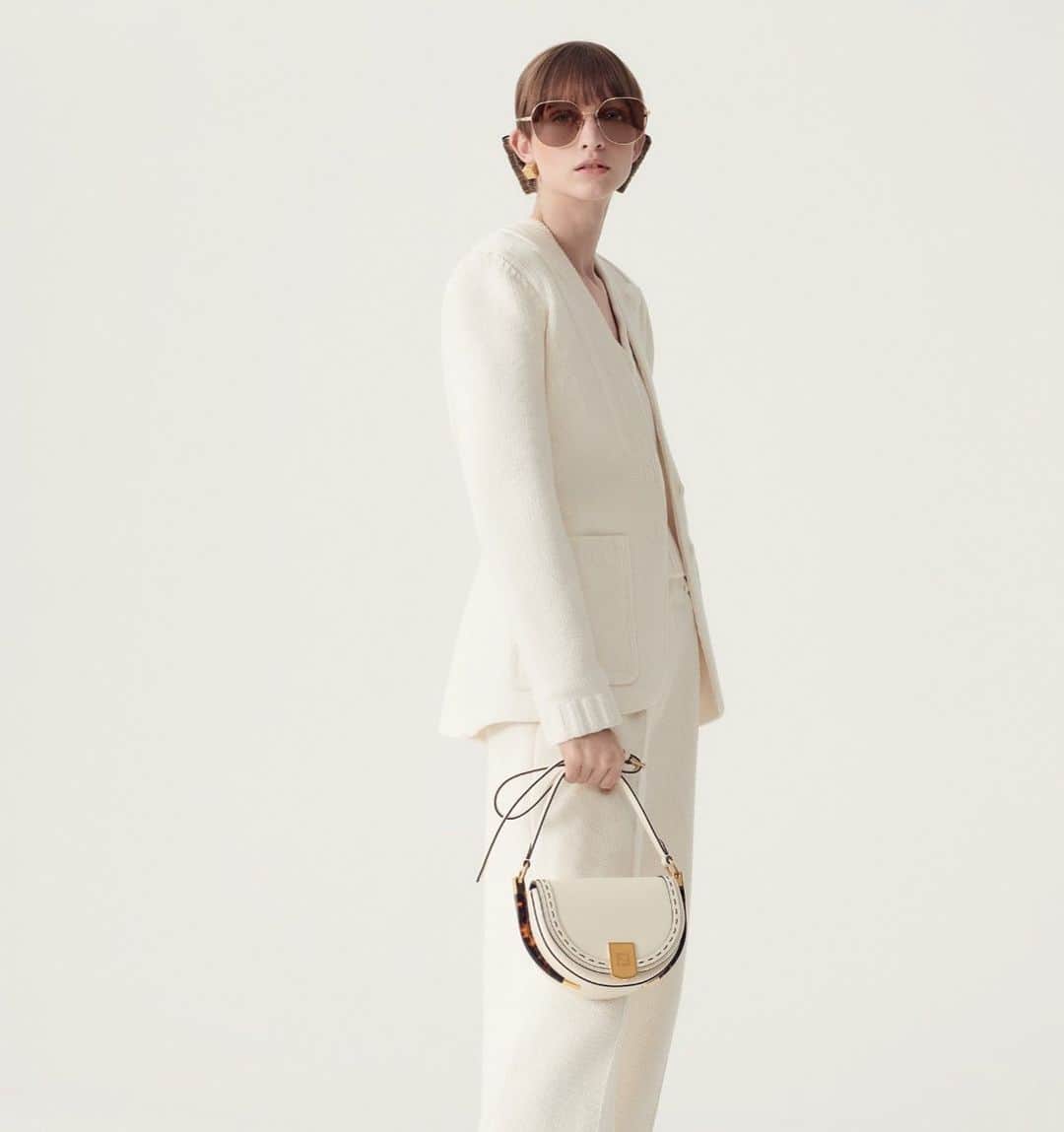 Fendiのインスタグラム：「The distinctive codes of the Sunshine Shopper, reworked in a mini satchel – discover the new #FendiMoonlight bag and more #FendiSS21 arrivals at Fendi.com.  Photographer: @brunostaub Stylist: @giovannidariolaudicina Models: Maty Fall, Maggie Cheng, Alex Andrews and Vilma Sjoberg」