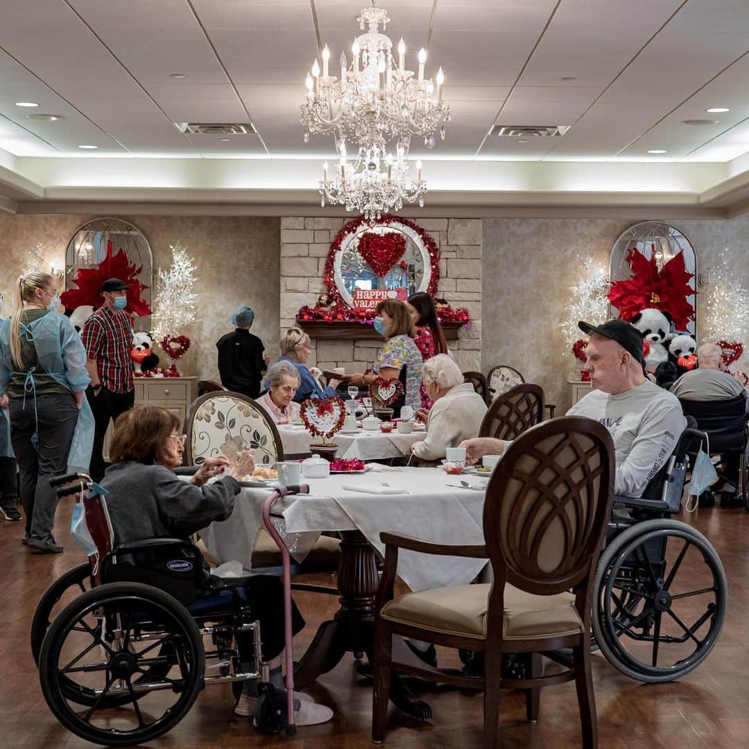 ニューヨーク・タイムズさんのインスタグラム写真 - (ニューヨーク・タイムズInstagram)「A nursing home in West Virginia has finished vaccinations — and now residents are getting a glimpse at what the other side of the pandemic might look like.⁣ ⁣ After nearly a year in lockdown for the residents of Good Shepherd Nursing Home — eating meals in their rooms, playing bingo over their television sets and isolating themselves almost entirely from the outside world — their coronavirus vaccinations were finished and the hallways were slowly beginning to reawaken.⁣ ⁣ In a first, tentative glimpse at what the other side of the pandemic might look like, Betty Lou Leech, 97, arrived at the dining room early, a mask on her face, her hair freshly curled.⁣ ⁣ “I’m too excited to eat,” she said, sitting at her favorite table once again.⁣ ⁣ It has been a miserable year for American nursing homes. More than 163,000 residents and employees of long-term care facilities have died from the coronavirus, about one-third of all virus deaths in the U.S. Infections have swept through some 31,000 facilities and nearly all have had to shut down in some way.⁣ ⁣ West Virginia has emerged as one of the first states to finish giving two doses of vaccines to the thousands of people inside its nursing homes, so Good Shepherd, a 192-bed Catholic home in Wheeling, was among the first facilities in the country to begin tiptoeing back toward normalcy this past week.⁣ ⁣ The first day back was full of ordinary moments: small talk over coffee, bidding wars at an afternoon auction, a game of dice. But after a year of loss, loneliness and disruption, the very ordinariness of it all brought joy and relief.⁣ ⁣ Tap the link in our bio to see more from inside the nursing home. Photos by @amr.alfiky⁣」2月16日 2時31分 - nytimes