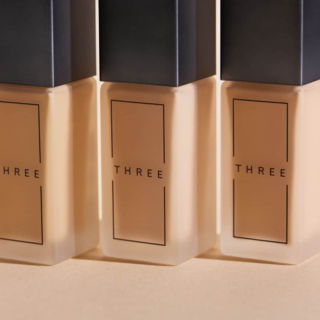 THREEのインスタグラム：「・ ＜かげりなきラディアントな上質肌へ＞ エイジング*や肌悩みが気になるとき。 より上質な肌感で自分を表現したいとき。  心地よいメイクを自分のために楽しみたいとき。   バランスを大切にしたエフォートレスな補正で、影による肌表面のノイズがおさまると同時に、 毛穴を感じない透明感のある仕上がりをキープ 。 肌全体がキュッと引き締まったような スムースリフティング**効果によるハリのある質感を、  THREEならではの処方で、軽やかに心地よく叶えます。 ―――――――――――――― THREE アドバンスドエシリアルスムースオペレーター フルイドファンデーション 全8色 30mL 8,800円（税込） 2021年2月24日発売 ―――――――――――――― 203のミドルカラー（標準色）をはじめ、様々なお肌の色に対応できる全8色をご用意。 同シリーズのプライマーで整えた肌にさらなるハリ感を与え、 晴れやかで明るい自然体を引き出すフルイドファンデーションで、どこから見ても余裕のある、フローレス&ラディアントな表情へと導きます。   *年齢に応じたお手入れのことです。 **メイク効果による #THREE #NEWBASEMAKEUP #threecosmetics #アドバンスドエシリアルスムースオペレーターフルイドファンデーション #ラディアントスキン」