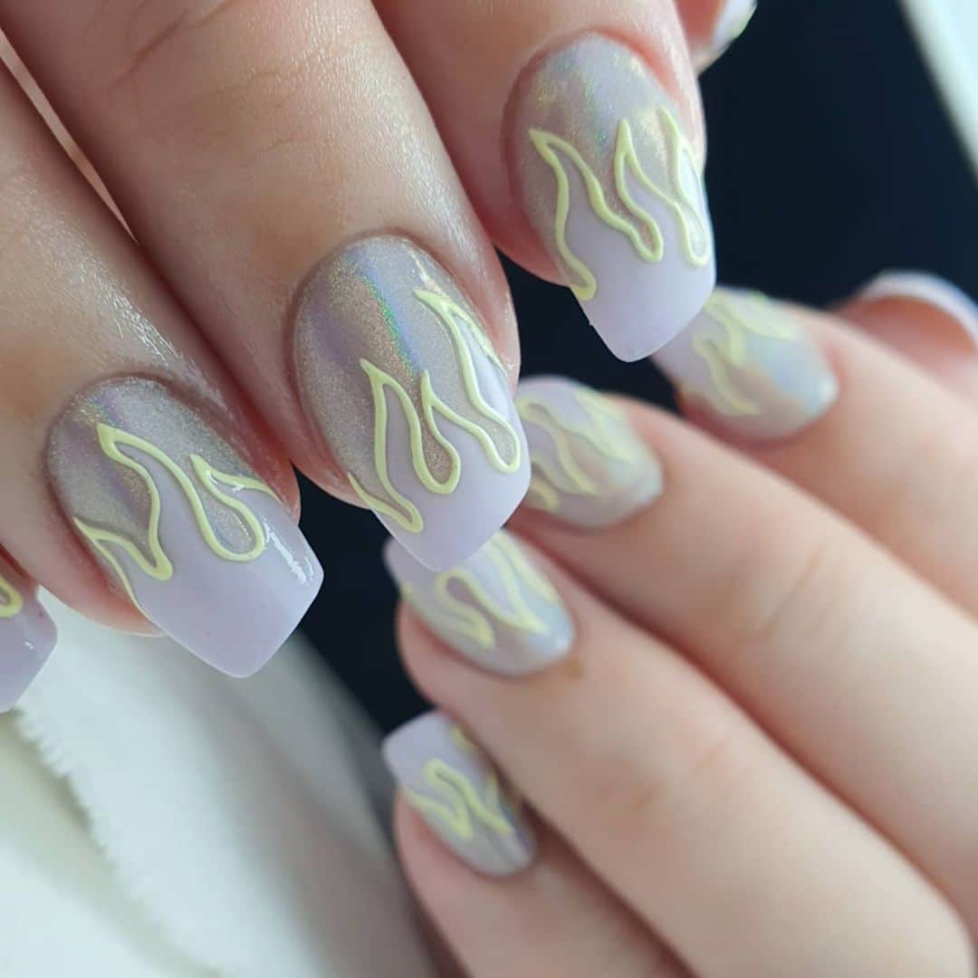Yingのインスタグラム：「These were her natural nails! She has short nail beds and dry nails that curve and distort once they extend past the nail bed, so shaping them into a lipstick shape was a challenge, especially since they were not long enough  either 😅  I used PREGEL Tulle Grege,  PREANFA Planet Powder in Meteor Shower for the holographic chrome tips, and did flames in custom-mixed colours. Outlines were also custom mixed with PREGEL Art Liner Gels for embossed effect! Swipe left for reference pic provided by client 😊  Items can be purchased at @nailwonderlandsg 🤗 . . . 🛒 www.nailwonderland.com⁣⁣ 📍20A Penhas Road, Singapore 208184⁣⁣ (5 minutes walk from Lavender MRT)⁣⁣ .  I am currently only able to take bookings from my existing pool of customers. If I have slots available for new customers, I will post them on my IG stories. Thank you to everyone who likes my work 🙏 if you need your nails done, please consider booking other artists at @thenailartelier instead ❤  #ネイルデザイン  #ネイルアート #ネイル #ジェルネイル #nailart #네일아트 #pregel #プリジェル #nails #gelnails #sgnails」