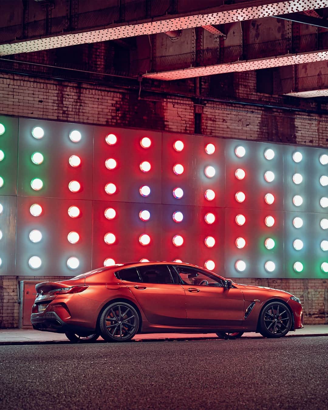 BMWのインスタグラム：「Immerse yourself in the lights of the night.  The BMW 8 Series Gran Coupé, #THE8 #BMW #8Series #BMWrepost @khalid_bari @mo_reviews __ BMW 840i Gran Coupé: Fuel consumption weighted combined in l/100km: 7.4–7.2 (NEDC); 8.7–8.2 (WLTP), CO2 emissions weighted combined in g/km: 171–166 (NEDC); 199–186 (WLTP). Further information: www.bmw.com/disclaimer.」