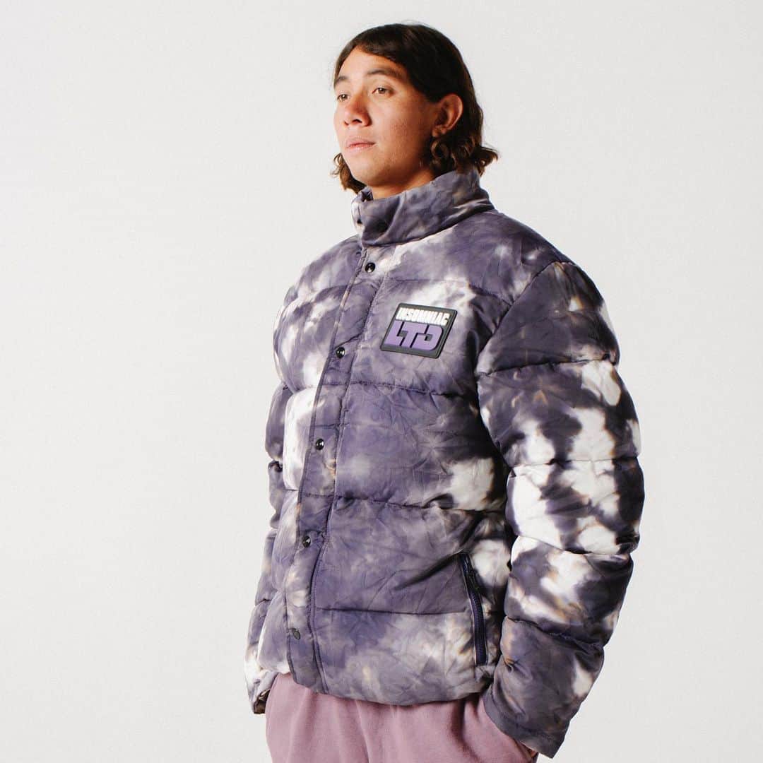 サキャスティックのインスタグラム：「@insomniacltd Pre Spring   Crystal Puffer Jacket Crystal & Black Japanese hand dyed nylon shell, down filled nylon lining, zip front with storm flap, front rubber patch, embroidered back logo. Made in USA.  Fireball L/S Tee Purple 6.5 oz medium weight cotton T, pre-shrunk, custom tie dye design, silkscreen chest print, made in USA.  Opaque Sweatpant Purple Heavyweight cotton fleece, pre-shrunk, custom logo drawcords, embroidered patch, back patch pocket. Made in the USA.」