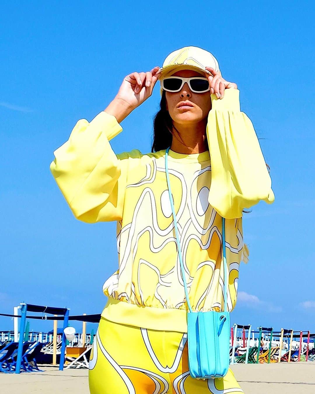 サラバターリアのインスタグラム：「...JOIE DE VIVRE  SPRING SUMMER 21   Nicole wears the Plissè Bucket XS with top and leggings in Yellow Sunset color   Available on sarabattaglia.com and in the best stores  #SaraBattaglia #JoieDeVivre」