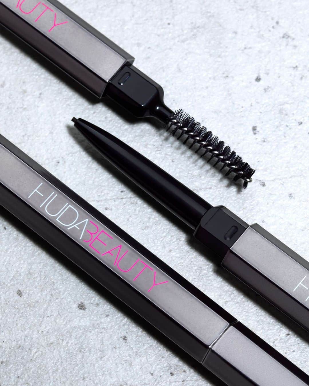 Huda Kattanさんのインスタグラム写真 - (Huda KattanInstagram)「OMG!! Can’t believe we’ve just revealed our FIRST EVER brow product… 🔥 #BOMBBROWS Microshade Brow Pencil 🔥 Create true works of arch with the the THINNEST tip possible for a brow pencil (0.9mm) that gives the most realistic, hair-like strokes you get from a pen, with the blendability and ease of a pencil - like microblading without the pain! It's also waterproof, smudge-proof, super long wearing (24 hours), no transfer and comes in 8 stretchable shades.  ⠀⠀⠀⠀⠀⠀⠀⠀⠀ Head to YouTube for the full reveal & my first ever #BombBrows tutorial (link in bio). Launching Feb 23 everywhere!」2月18日 2時04分 - hudabeauty