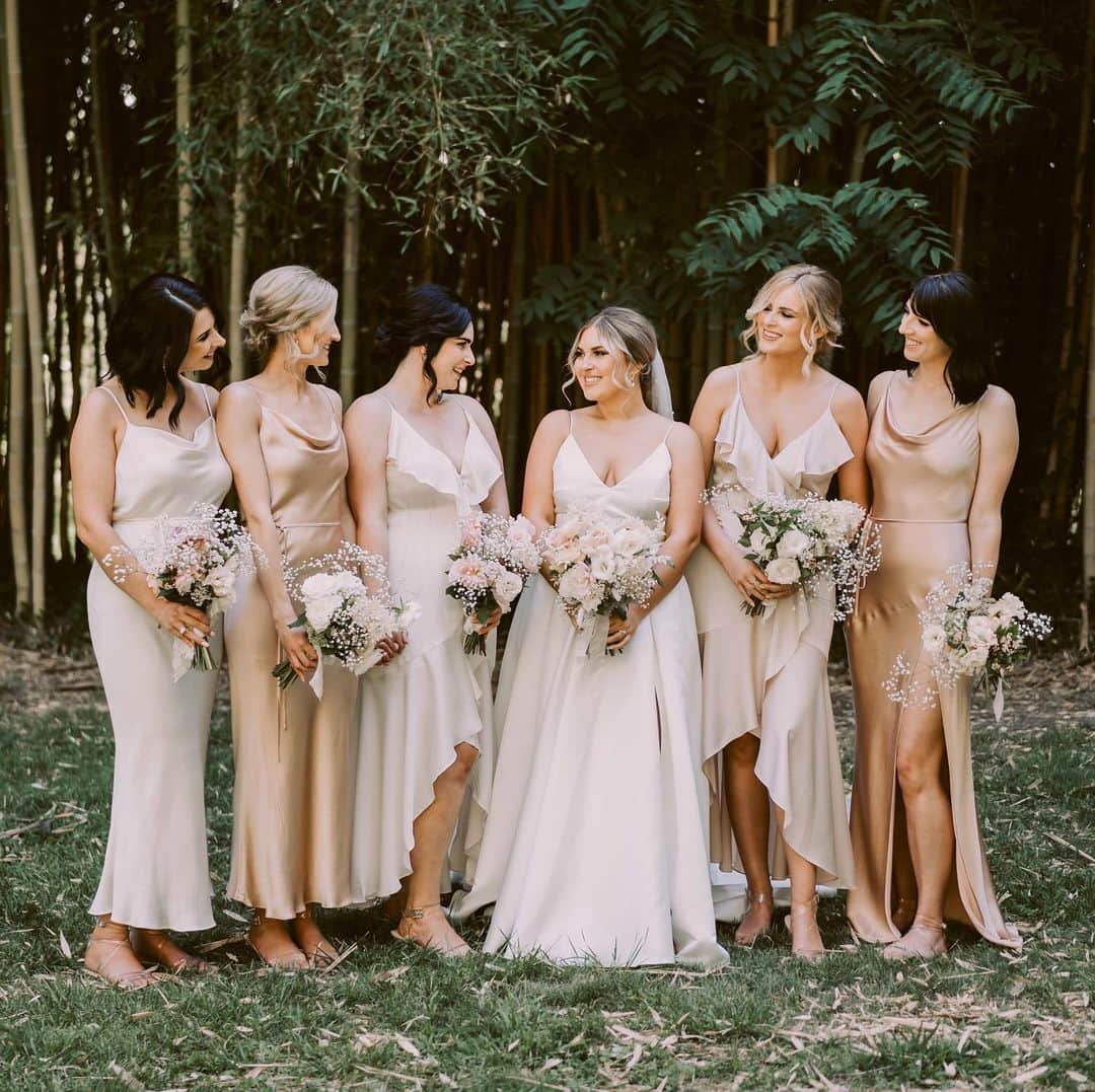 Shannonのインスタグラム：「Sorry but how gorgeous are my friends 😩👌🏼 My beautiful bridesmaids were dressed by @designer.wardrobe which is a rental service that does offer bridesmaids options too! 💓😘 my besties all looked so so stunning on the day 🤍 definitely recommend them if you are looking for formal options, or an outfit for yourself for any occasion! I’ve worn their cute outfits for years so I was so excited to be able to find the most amazing dresses with them! 🐚 I went for a nice neutral palette of colors, with each girl in a different style variation as well, because I wanted everyone to match yet still be unique! AD 😍 the girls shoes were bought off @misslolaofficial @misslola, the earrings are @taimanaboutique and @aylaandoak 🦋 @makeupbyannalee did the girls makeup and hair was all done by @dededaph 👌🏼 dream team 💍 photos by @davidle_nz 📸」