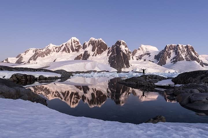 National Geographic Travelさんのインスタグラム写真 - (National Geographic TravelInstagram)「Photo by @daisygilardini / This is a self-portrait of me in Antarctica, which really represents how I feel when on the white continent! There are only a few places left on Earth where you can be totally cut off from the hysteria of our “civilized” world.  Antarctica is one of those places. It's a place where your heart and soul can find refreshed energy simply by being there, in the present, totally mesmerized by nature’s beauty.  Follow me @daisygilardini for more images and behind-the-scenes stories. #antarctica #sunset #landscapephotography #isolation #climatechange」2月19日 8時36分 - natgeotravel