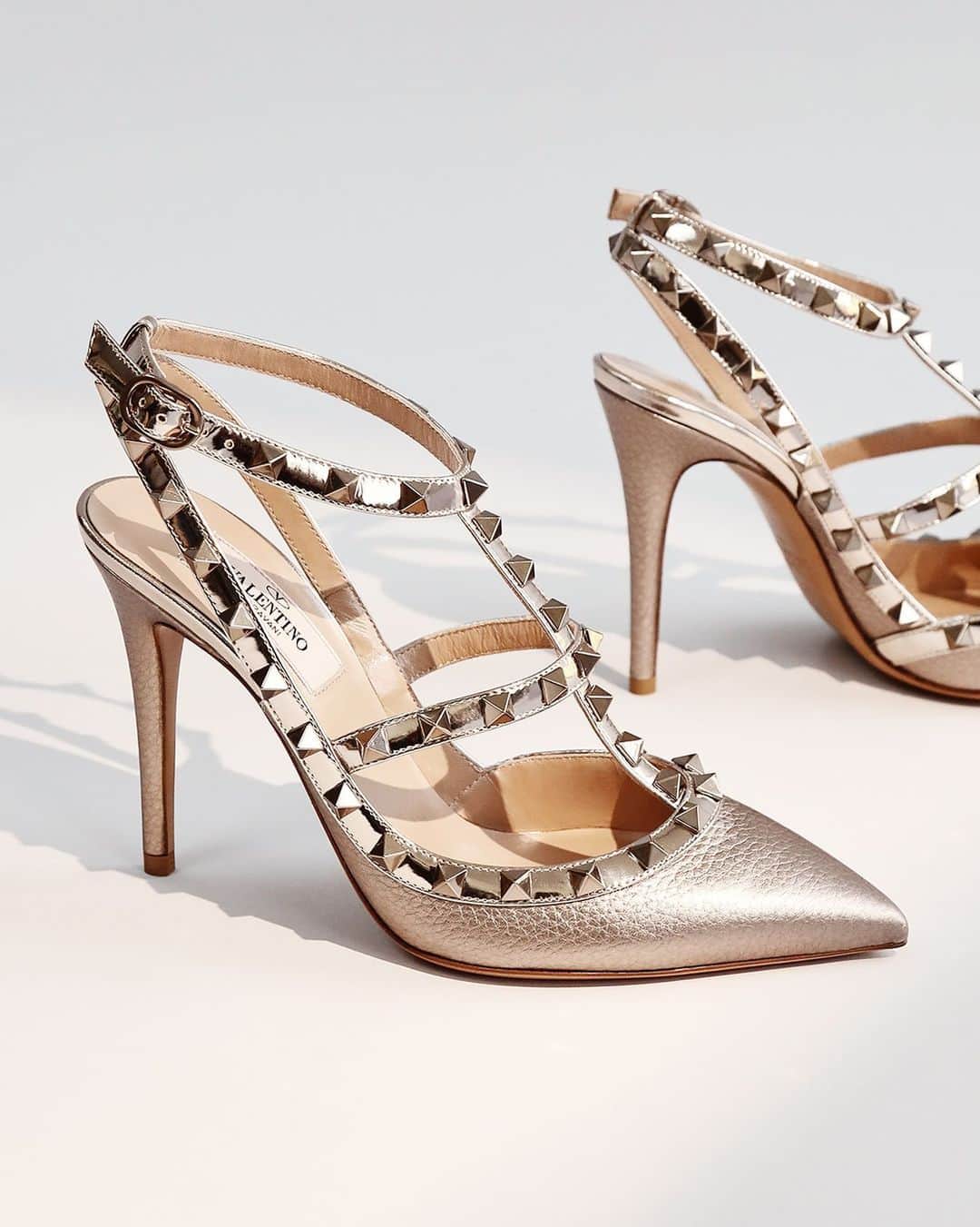 The Outnetのインスタグラム：「Rockstud n' roll — in these @maisonvalentino metallic heels, you're ready for anything.   Shop all your favorite Instagram looks, just visit the link in bio」