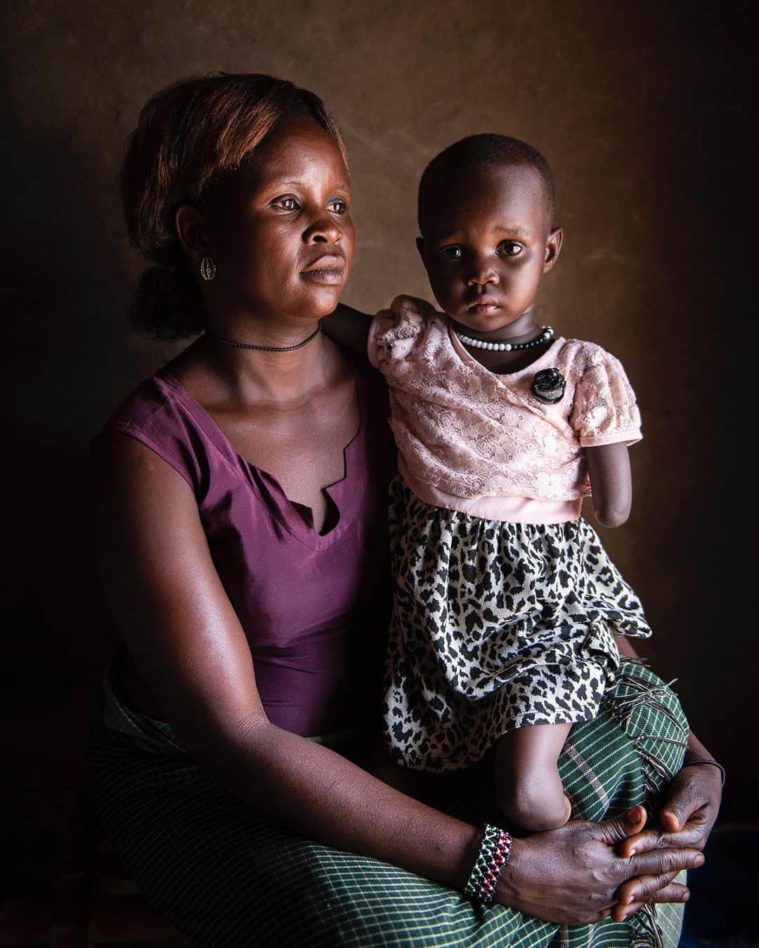 thephotosocietyさんのインスタグラム写真 - (thephotosocietyInstagram)「Photo by @noralorek // In 2015, just a year before fleeing the civil war in South Sudan, Margret gave birth to Sarah.  ’When I first saw her and realized she had no arms or legs I was confused and afraid. How would she ever be able to walk? But now I’ve seen how strong and resistant she’s become by growing up here’, Margret said.   Carrying Sarah to Uganda, she fled South Sudan with her four children and mother. ’I didn’t want to leave South Sudan but when they shot my husband I had no other chance than taking our children and leave.’   Five years ago the area containing the Bidibidi refugee settlement was a forest in northwestern Uganda. Now it’s a makeshift home for a quarter million refugees who fled the civil war in South Sudan.」2月19日 2時59分 - thephotosociety