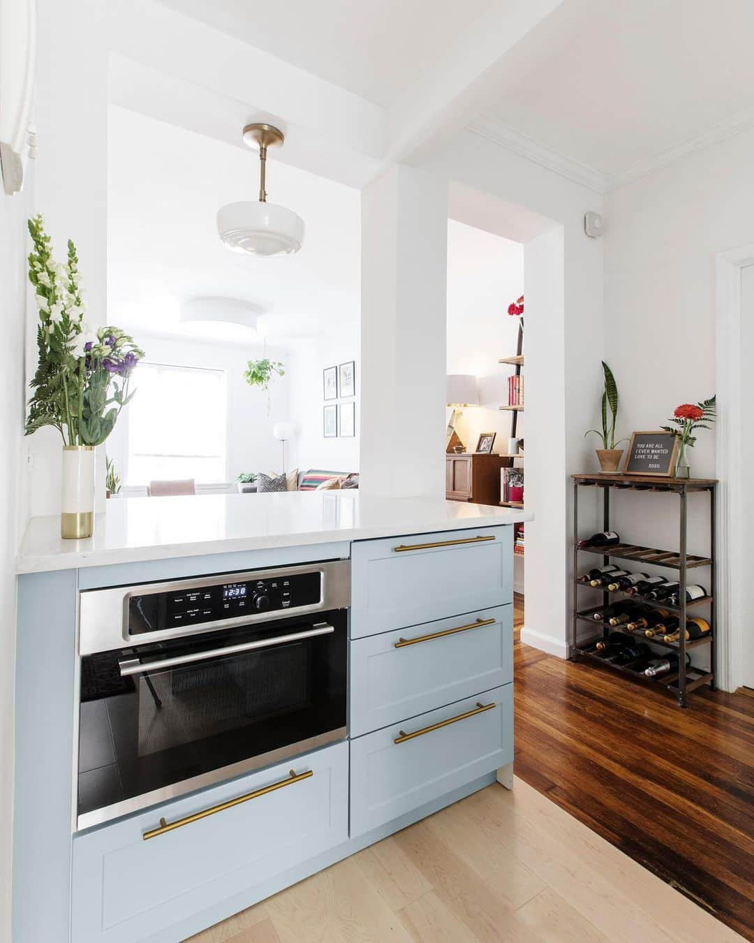 Sweeten Homeのインスタグラム：「Agave cabinets and warm brass hardware transform a dim and cramped kitchen into an oasis in this #sweetenreno 😍 Swipe for B&As and visit the link in our bio for more reno details.⁠⁠ ⁠⁠ Cabinets: @semihandmade⁠⁠ Pendant Lighting: @rejuvenation」