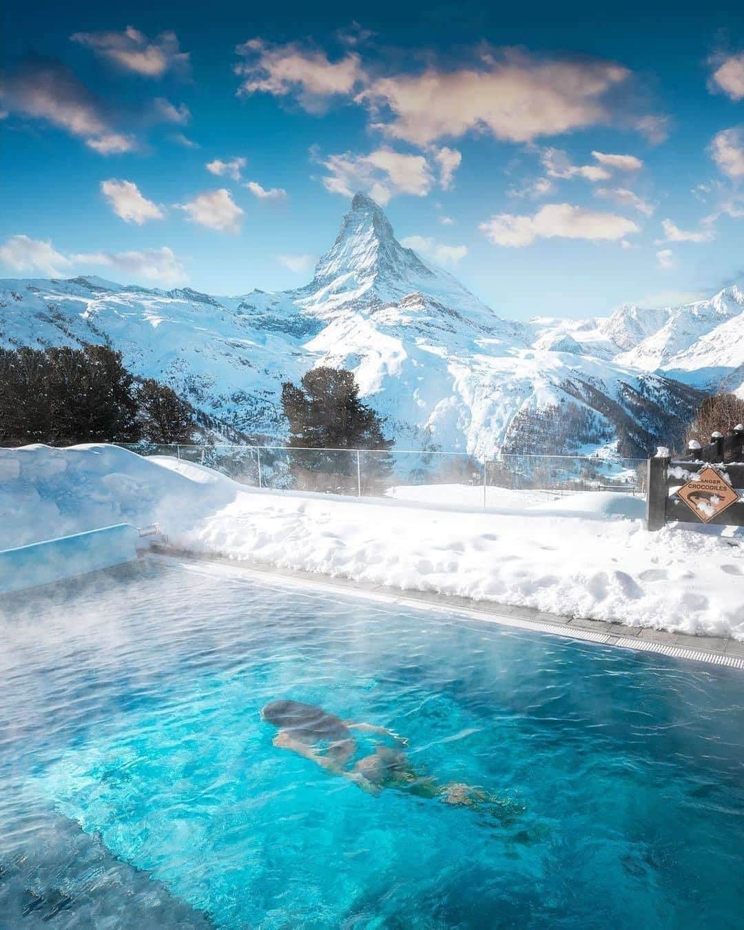 Discover Earthさんのインスタグラム写真 - (Discover EarthInstagram)「In Europe's highest spa, you will experience pure well-being and enter an oasis of deep relaxation. 🇨🇭 The outdoor swimming pool, heated to 35° C, is surrounded by a magnificent panorama of the Valais mountains and offers an exceptional view of the Matterhorn, this splendid emblem of Switzerland.  Tag the person you'd like to share this pool and breathtaking view with! 📍 @riffelalpresort2222m , Zermatt, Switzerland 🇨🇭 #discoverswitzerland  with @adrianbaias & @florina__toma   . . . . .  #suisse  #svizzera  #schweiz  #igersswitzerland  #switzerland  #switzerlandwonderland  #inlovewithswitzerland  #myswitzerland  #visitswitzerland  #ig_switzerland  #exploreswitzerland  #swiss  #igerssuisse  #iloveswitzerland  #suiza  #amazingswitzerland ​#ticin ​#genev  #швейцария  #switzerland_vacations ​#genev  #switzerlandpictures ​#swissalp ​#visitticin  #vacantion  #alps ​#valai ​#lacleman  #lac」2月20日 21時00分 - discoverearth