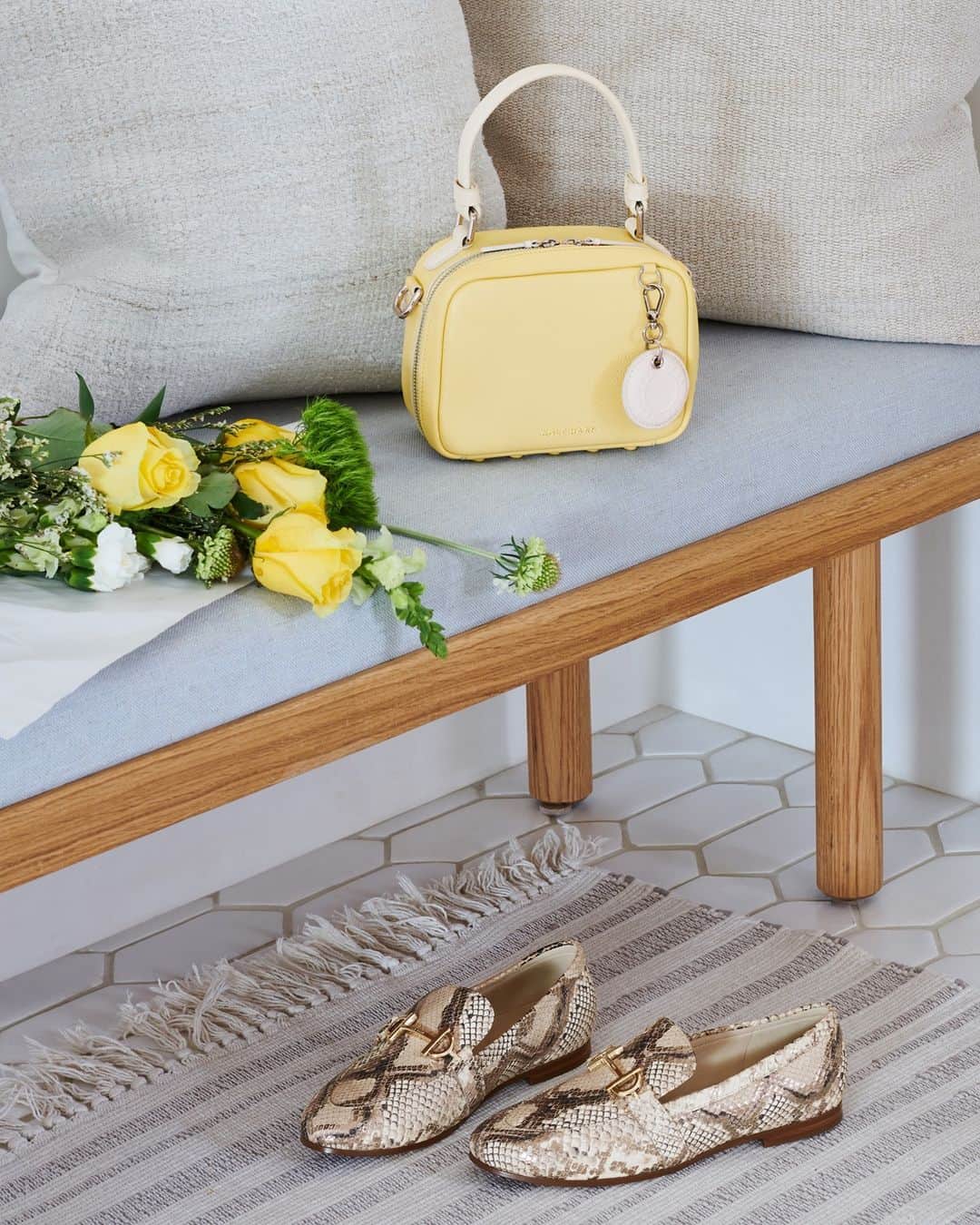 Cole Haanのインスタグラム：「Heading out? Our new Mini Boston Bag carries your essentials, our new Modern Classics Loafer offers effortless style, and roses are always good.」