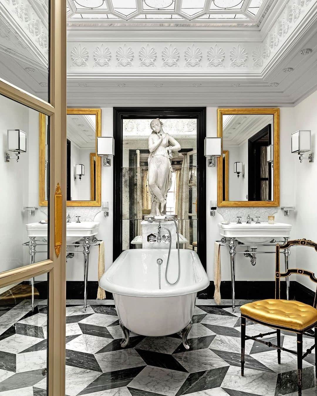 Homepolishのインスタグラム：「Maximalist, yet modern. @amarosanchezdemoya designed this master bath featuring @devondevon_official sinks and tub for a Seville client. We just want to linger in the bath this #selfcaresunday.  Photo:  @ricardolabougle   Check out the full project @elledecor」