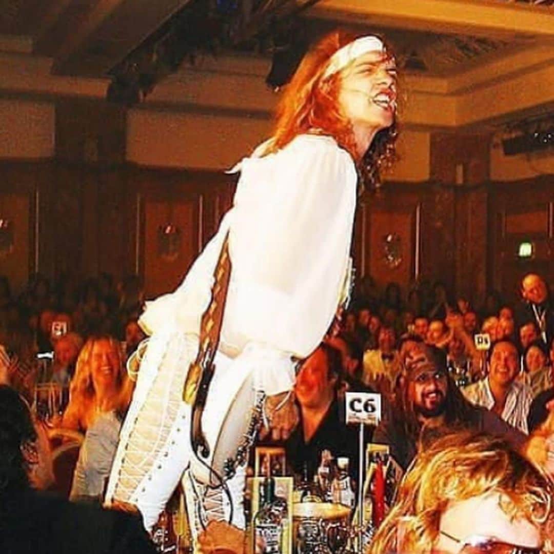 ロブ・ゾンビのインスタグラム：「Found this picture of @theactualdarkness playing at the @kerrangmagazine_ awards back in 2003. Justin jumped on our table. Killer set. 👍🏼Second picture is 2012 in my dressing room at @rockontherange . #thedarkness #kerrangmagazine #rockontherange #robzombie」