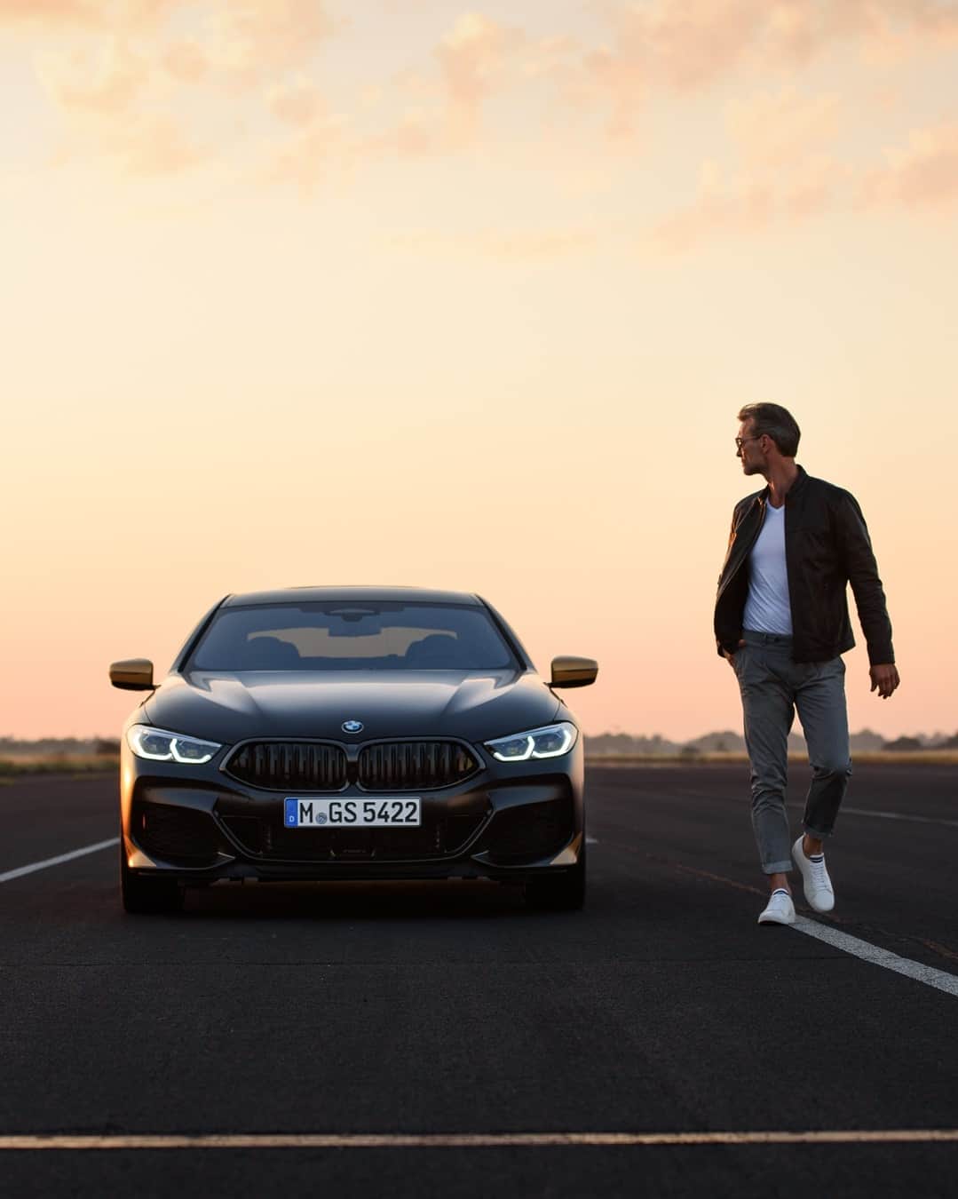 BMWのインスタグラム：「Sunset hunter. The BMW 8 Series Golden Thunder Edition. #THE8 #BMW #8Series __ BMW M850i xDrive Gran Coupé: Fuel consumption weighted combined in l/100km: 10.2–10.1 (NEDC); 11.0–10.9 (WLTP), CO2 emissions weighted combined in g/km: 234–232 (NEDC); 252–248 (WLTP). Further information: www.bmw.com/disclaimer.   530 hp, 390 kW, 750 Nm, Acceleration (0-100 km/h): 3.9 s, Top speed (limited): 250 km/h.」