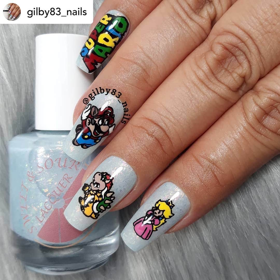 Nail Designsのインスタグラム：「Credit• @gilby83_nails Loved my new plate & polish from my recent purchase from @polishedgamers box and I had to create a new Mario mani.  Plate Used:  @apipilaoficial - Mario Plate  Polishes Used: @sweetandsourlacquer - World 1 @hellomaniology - Cherry Bomb  @hellomaniology - Skin Deep @hellomaniology - So Metal @bornprettystore - Scenery  @lacolorscosmetics - Pink @hlacosedora - Blue @santeenailpolish - Mango @pueencosmetics - Black Jack  @sweetandsourlacquer - Gloss Sauce  @unicornmagicskincare - Gummy Bear Scent Cuticle Oil   #ManiologyAmbassador #Nails💅🏽 #NailObsession #UberChic #Pueen #Maniology #ManiXMe #WhatsUpNails #UberChic0to10k #NailsDesign#NailPolishAddict #IHeartNailPolish #ILoveNailPolish #NailsOfTheDay #PolishAllTheNails #NailStamping #NailItDaily #NailStampingArt #NailArtWow #StampAllTheNails #StampedNails #NailsOfInstagram #Nailstagram #NailSpaFeature #CuteNails #MarioNails #PrincessPeach #Bowser #SuperMarioNails #SuperMario」