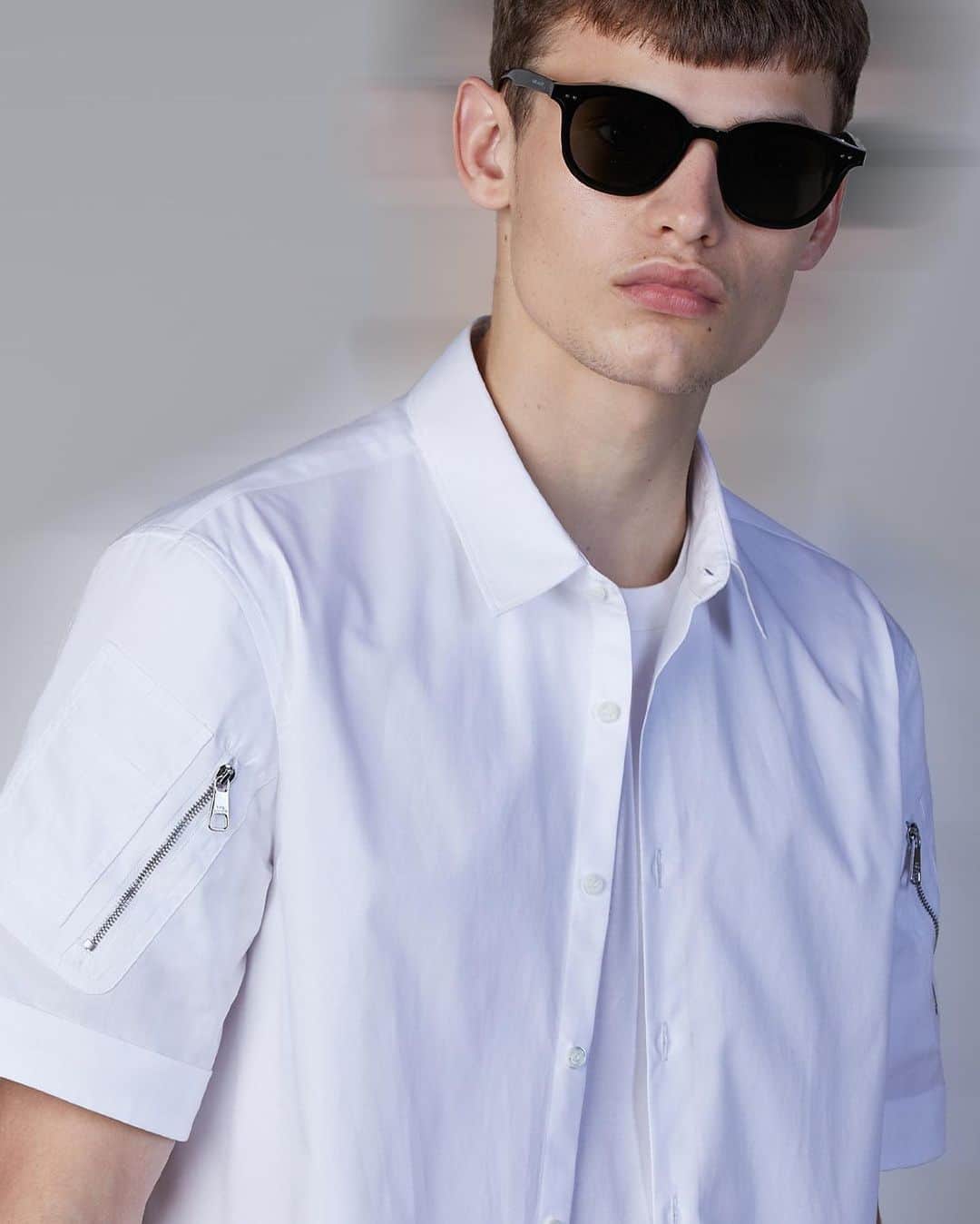 のインスタグラム：「DNA / A UNIFORM FOR THE EVERYDAY  The new NEIL BARRETT SS21 COLLECTION expresses the essence and meaning of the BRAND’S DNA.  @louis_gck in Neil Barrett Hybrid Vintage Cotton Shirt with Military Pockets on sleeves   Discover the New Collection at NeilBarrett.com  #NeilBarrett #SS21 #NewCollection #DNA」