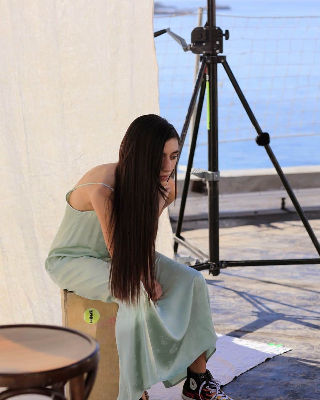 アメリカンビンテージのインスタグラム：「🇺🇸 Sky, sun and sea. Lost in thought, Amelie wears our GITAKA dress with embroidered details in jade green, both sensual and timeless. __ 🇫🇷 Le ciel, le soleil et la mer. Pensive, Amelie porte notre robe aux détails brodés GITAKA, dans sa couleur vert de jade, sensuelle et intemporelle à la fois. . #womenswear #americanvintage #SS21」