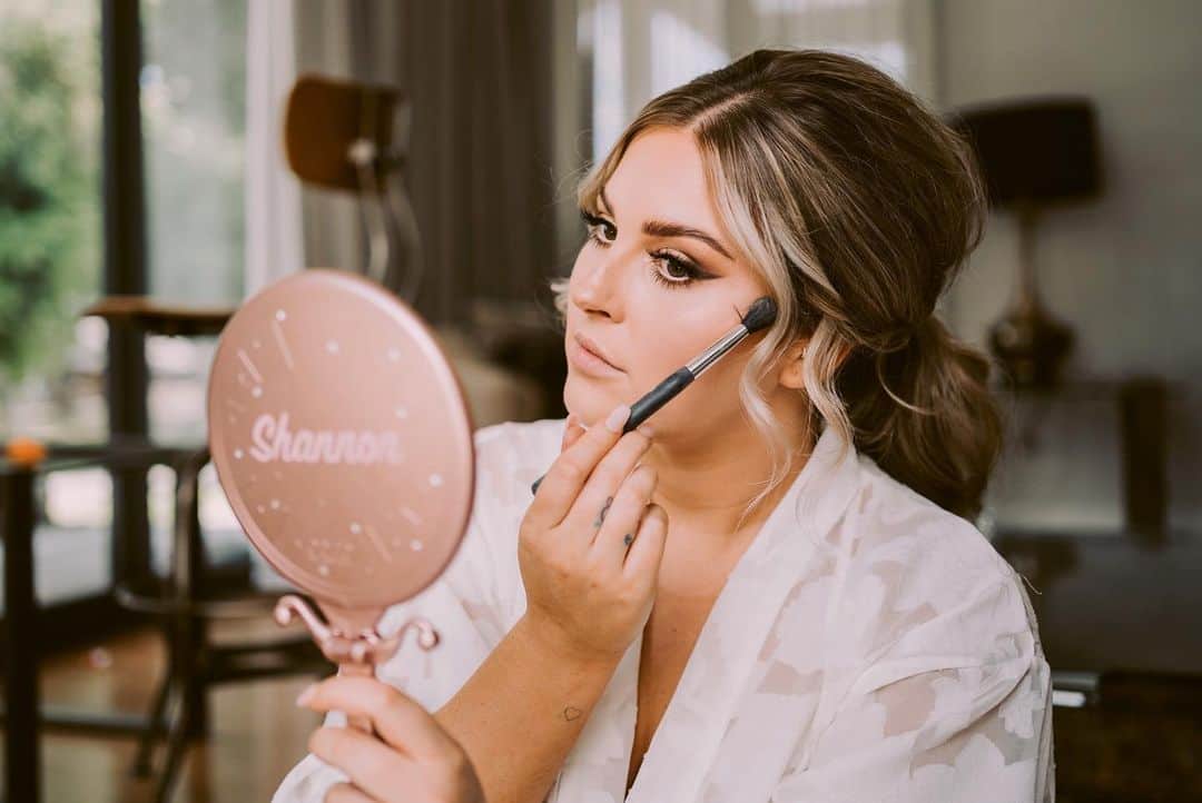 Shannonのインスタグラム：「GRWM from this moment is up on my YouTube channel now! 💓 I wanted to film a GRWM on my wedding day so I had something to focus on so I didn’t panic 😂 and it honestly helped! YouTube is my calm thing, and you guys are like thousands of besties from all around the world and I wanted to share the moment with you all! ILY! 🥺   Featured in these photos: @davidle_nz photography @trishpeng wedding dress @blumedarling coordination @bespokenprints invites @soeurlabel_ robes @aylaandoak earrings @eugaia bloom of course @revolve @rayethelabel heels @guerlain mon guerlain florale @blackwalnutvenue accom @makeupbyannalee touch ups @dededaph hairstyling  @xobeautyshop eyes and lips AD」