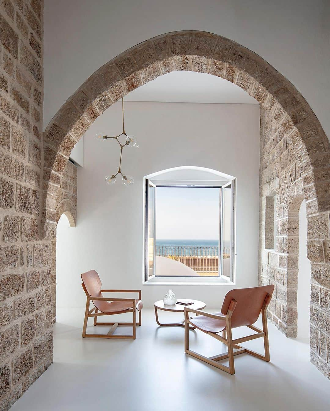 The Cool Hunterさんのインスタグラム写真 - (The Cool HunterInstagram)「The exterior of the Tipo949 renovation project by architects Raz Melamed and Omer Danan drew our attention first. We absolutely love the way this two-level apartment both stands out from and fits in within the sea-front walls of the 300-year-old stone structure.  Overlooking the Mediterranean Sea in the ancient port city of Jaffa, the oldest part of the Tel Aviv-Jaffa municipality, this residence is the height of urban cool in our opinion. It ticks off all of our favourites: renovation instead of a new-build, sensitive restoration, smart use of space, overall minimalist approach, open plan, gorgeous views … we could go on and on. (Link in bio) #swipeleft」2月24日 16時31分 - thecoolhunter_