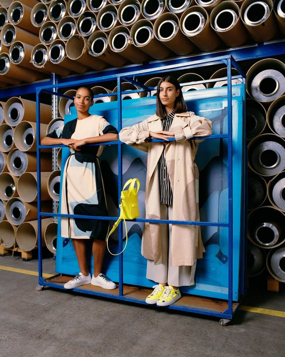 マリメッコのインスタグラム：「Our Pre-Spring collection introduces effortless dresses and other easy-to-wear pieces for the transitional season. Mix and match bold prints and colors, archive-inspired shapes and playful detail that celebrate our art of printmaking. ⠀⠀⠀⠀⠀⠀⠀⠀⠀ Fun fact: the campaign was shot in our printing factory here in Helsinki and the blue metal frames and cylinder-shaped shifters are used to print the fabrics. All the frames used in printing are handcrafted. ⠀⠀⠀⠀⠀⠀⠀⠀⠀ The Pre-Spring collection is now available at marimekko.com and in-store. #marimekko」